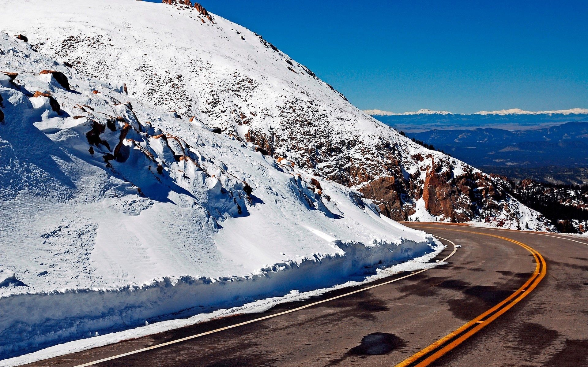 Download mobile wallpaper Snow, Road, Turn, Asphalt, Nature, Mountains, Lines for free.