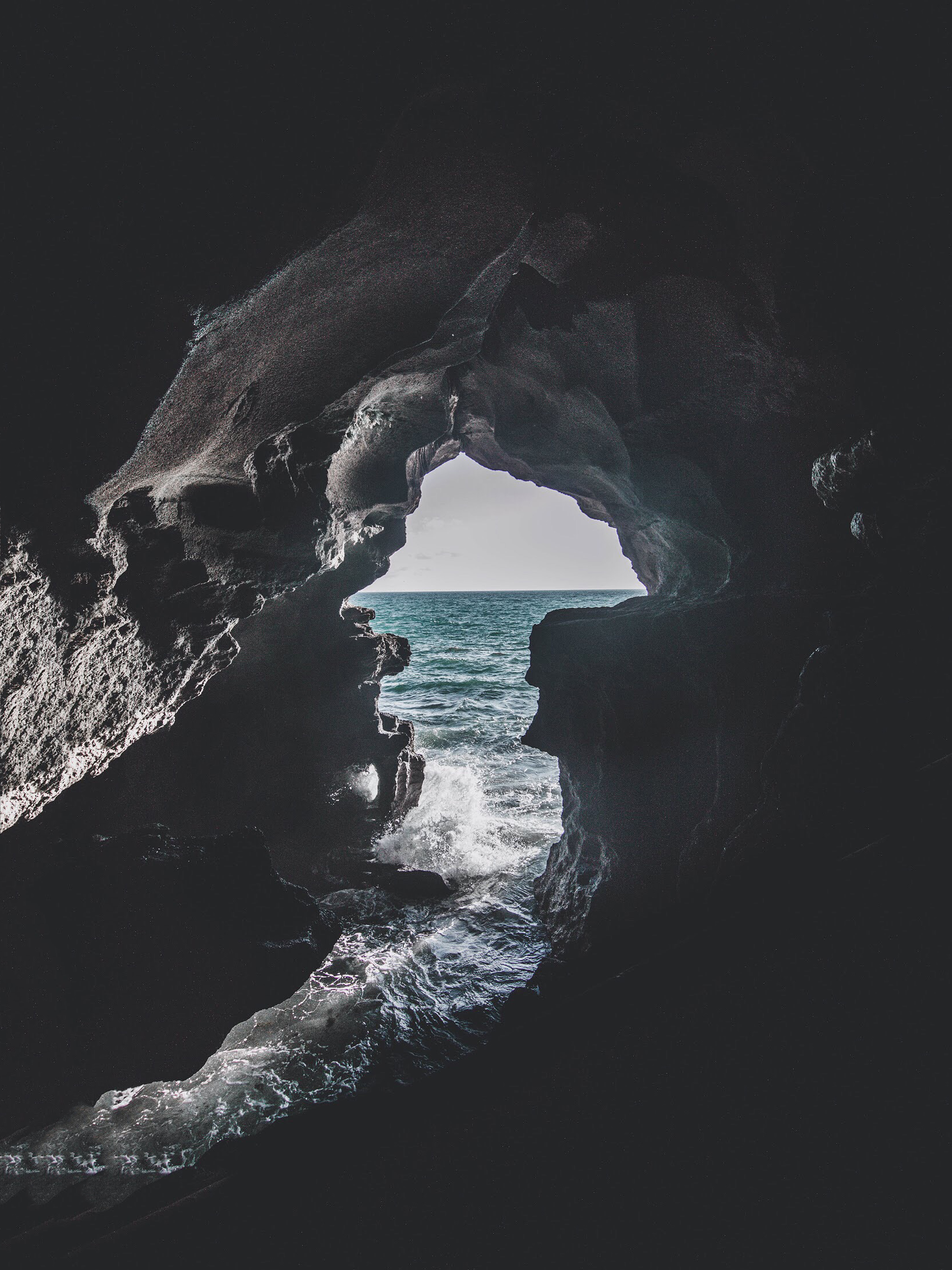 Download mobile wallpaper Foam, Stones, Surf, Nature, Sea, Cave for free.