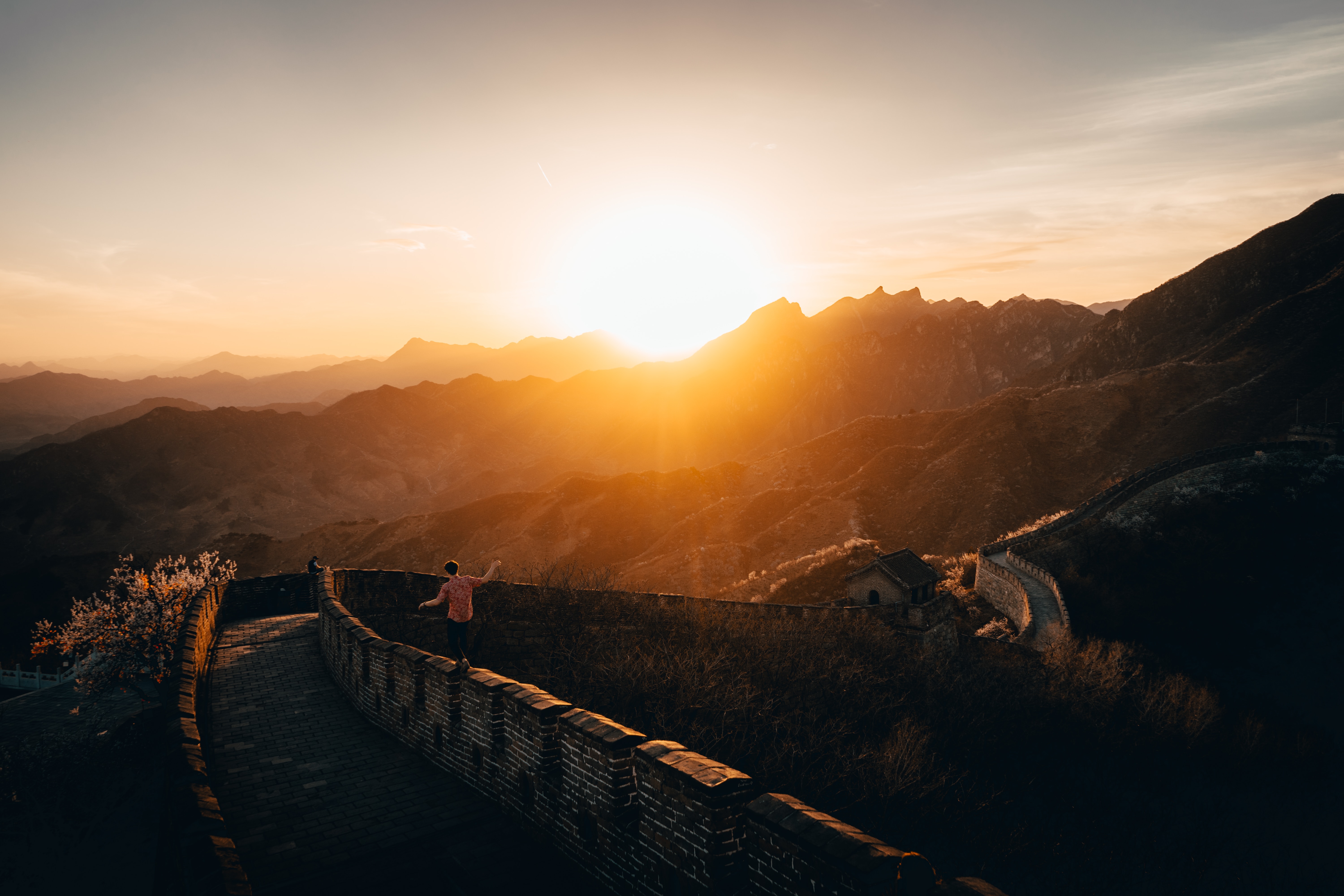 Free download wallpaper Mountains, Building, Nature, Sunset, Wall, People on your PC desktop