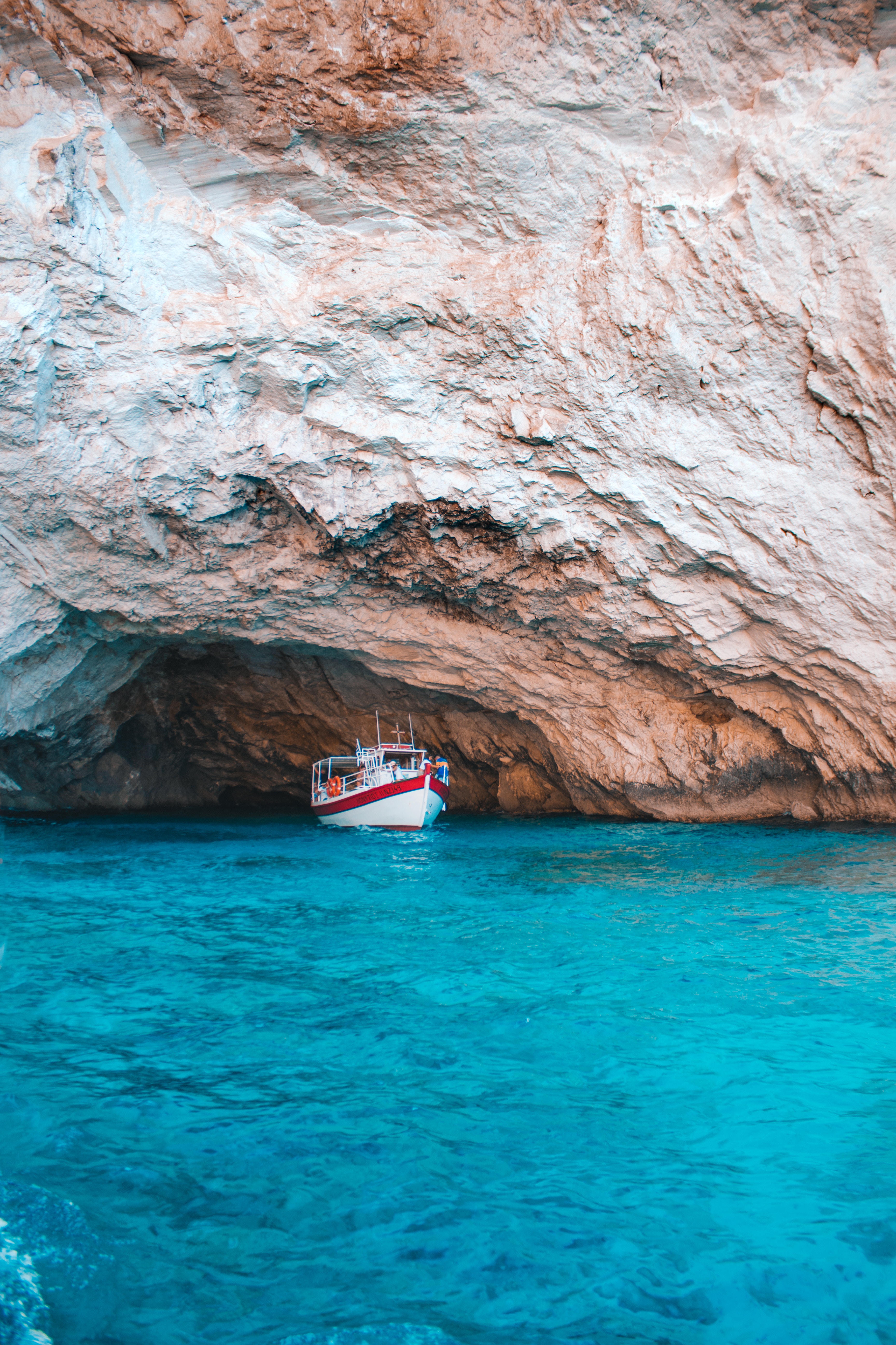 Download mobile wallpaper Rock, Sea, Bay, Water, Cave, Nature, Boat for free.