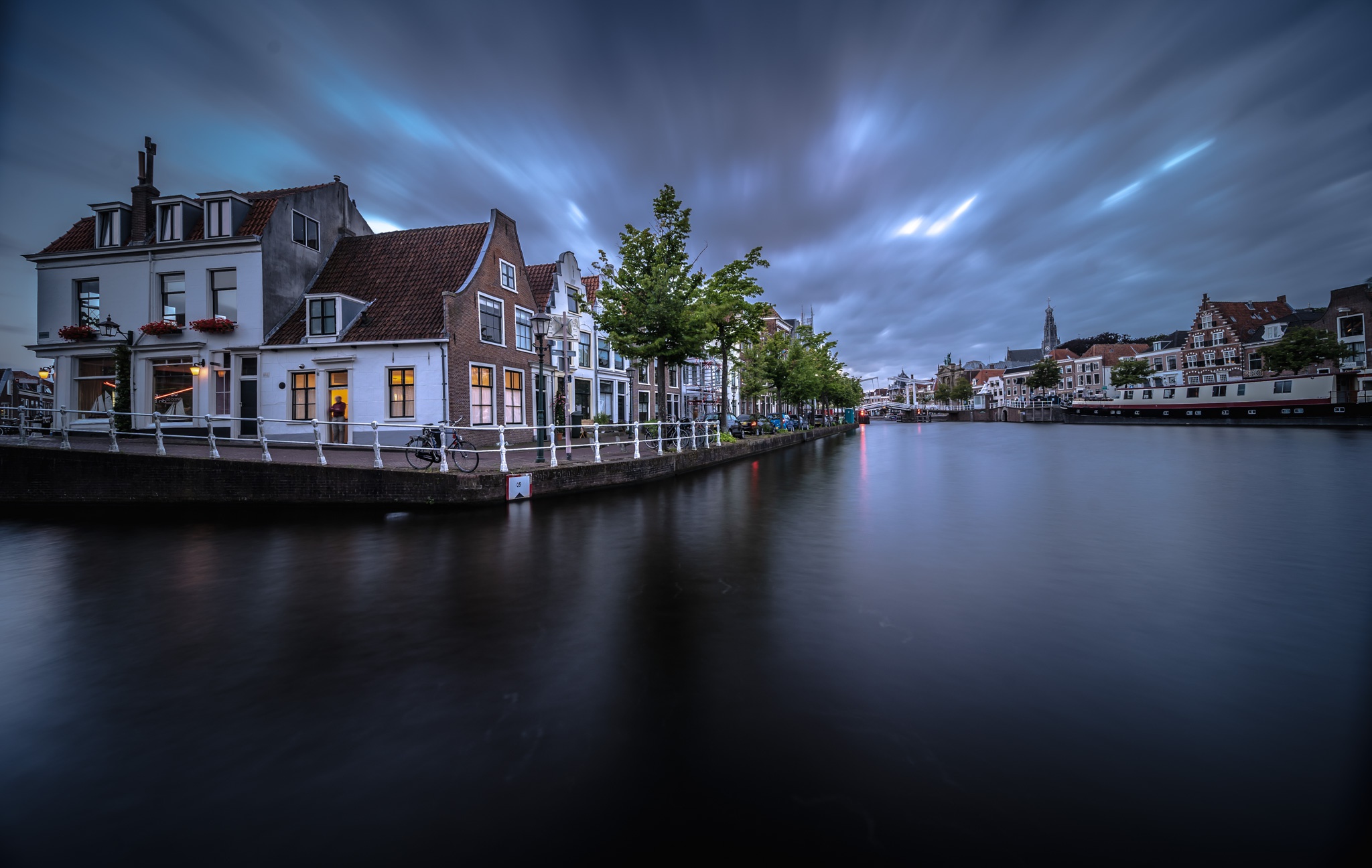 Free download wallpaper Twilight, City, House, River, Netherlands, Man Made, Haarlem on your PC desktop