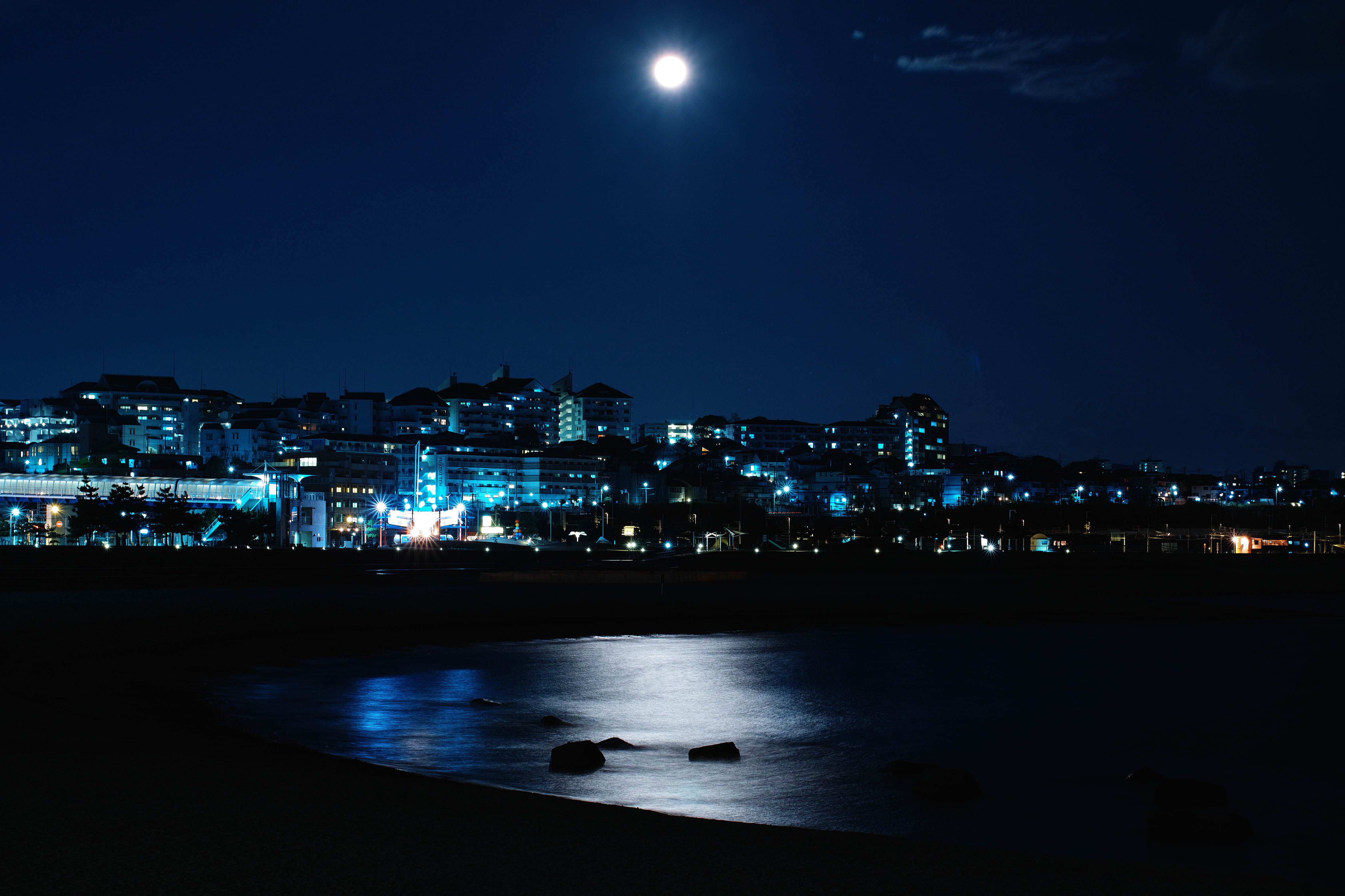 Download mobile wallpaper Bank, Shore, Cities, Building, Night City, Sea, Night for free.