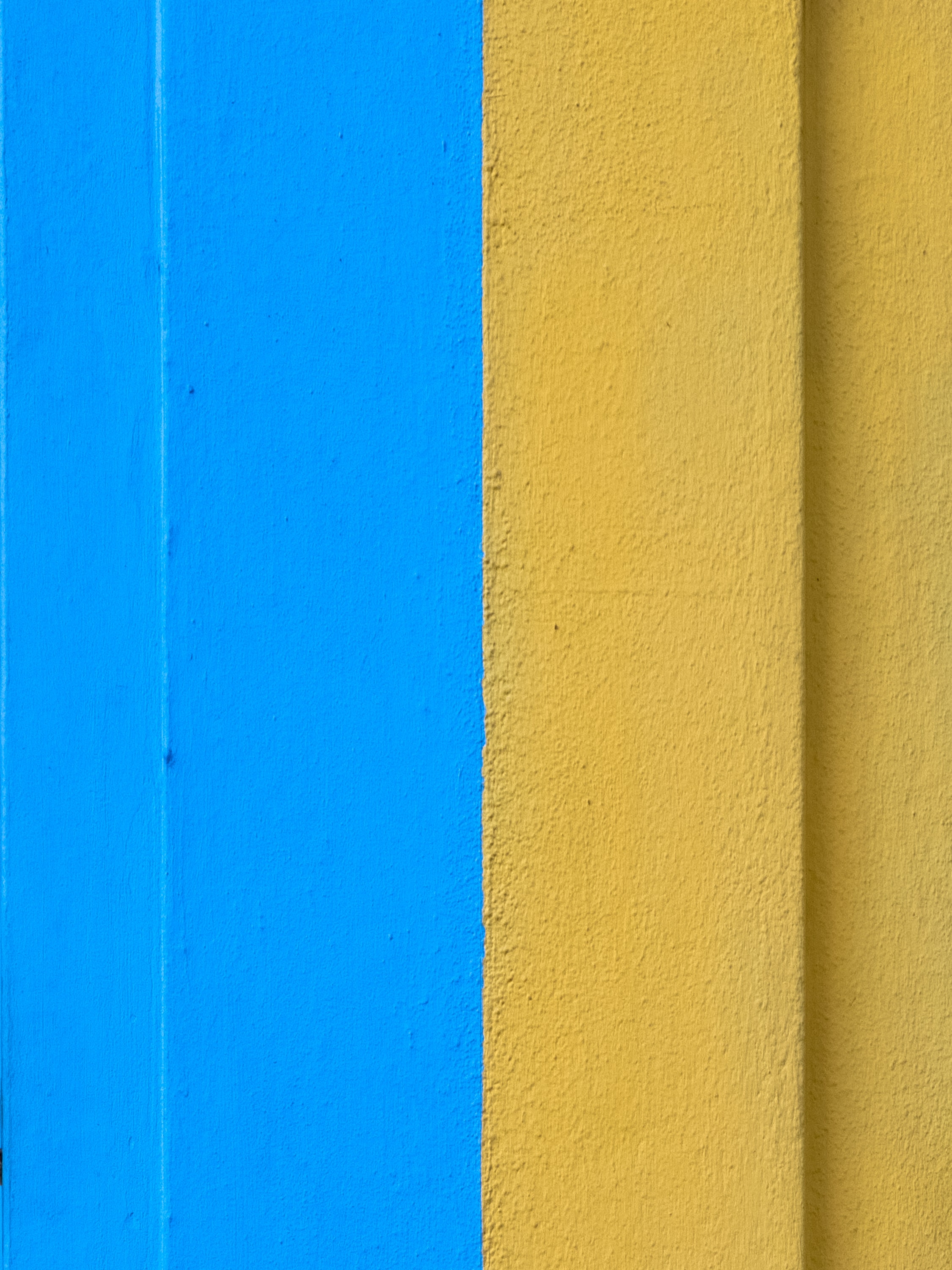 Скачать картинку Стена, Краска, Желтый, Текстура, Синий, Текстуры в телефон бесплатно.