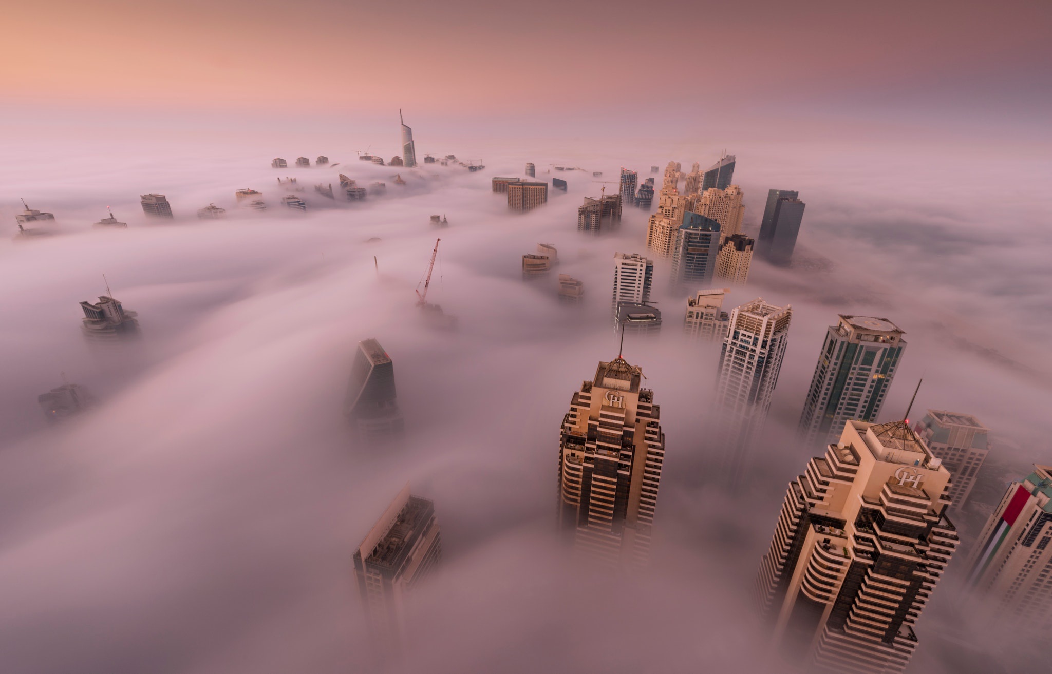 Download mobile wallpaper Cities, City, Fog, Dubai, United Arab Emirates, Man Made for free.