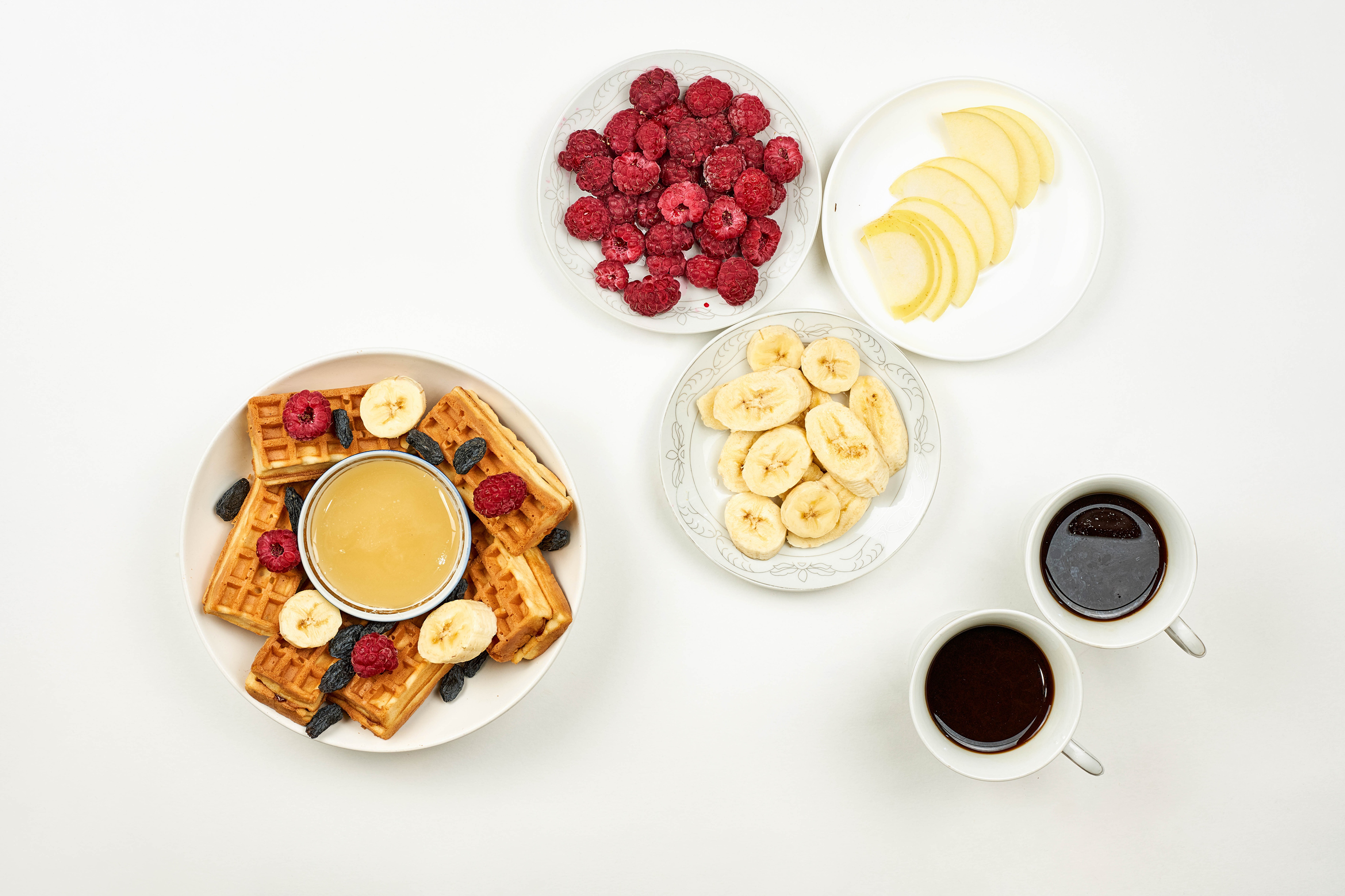 Download mobile wallpaper Food, Raspberry, Coffee, Cup, Berry, Plate, Fruit, Honey, Banana, Waffle, Breakfast for free.