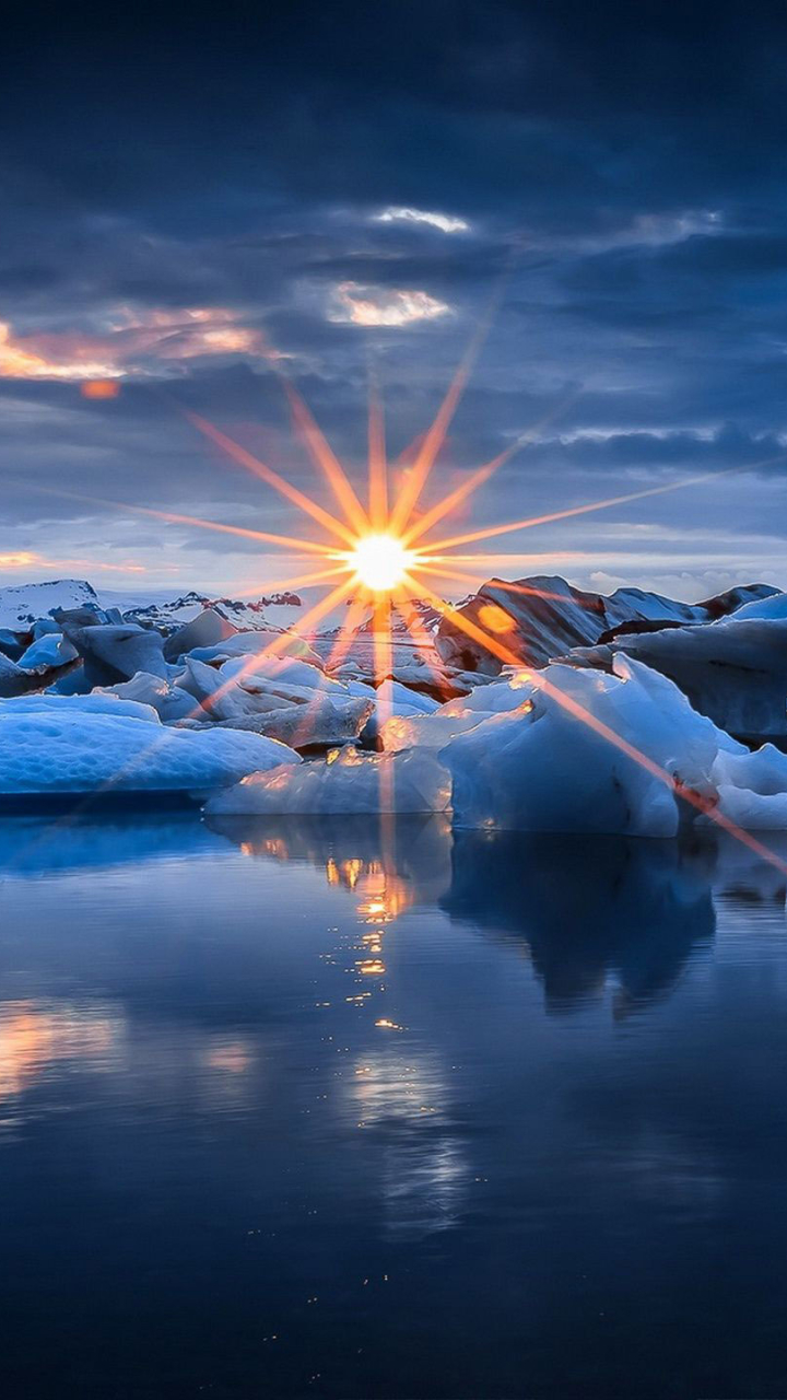 Download mobile wallpaper Winter, Nature, Sunset, Ice, Earth, Cloud, Sunbeam, Sunbean for free.