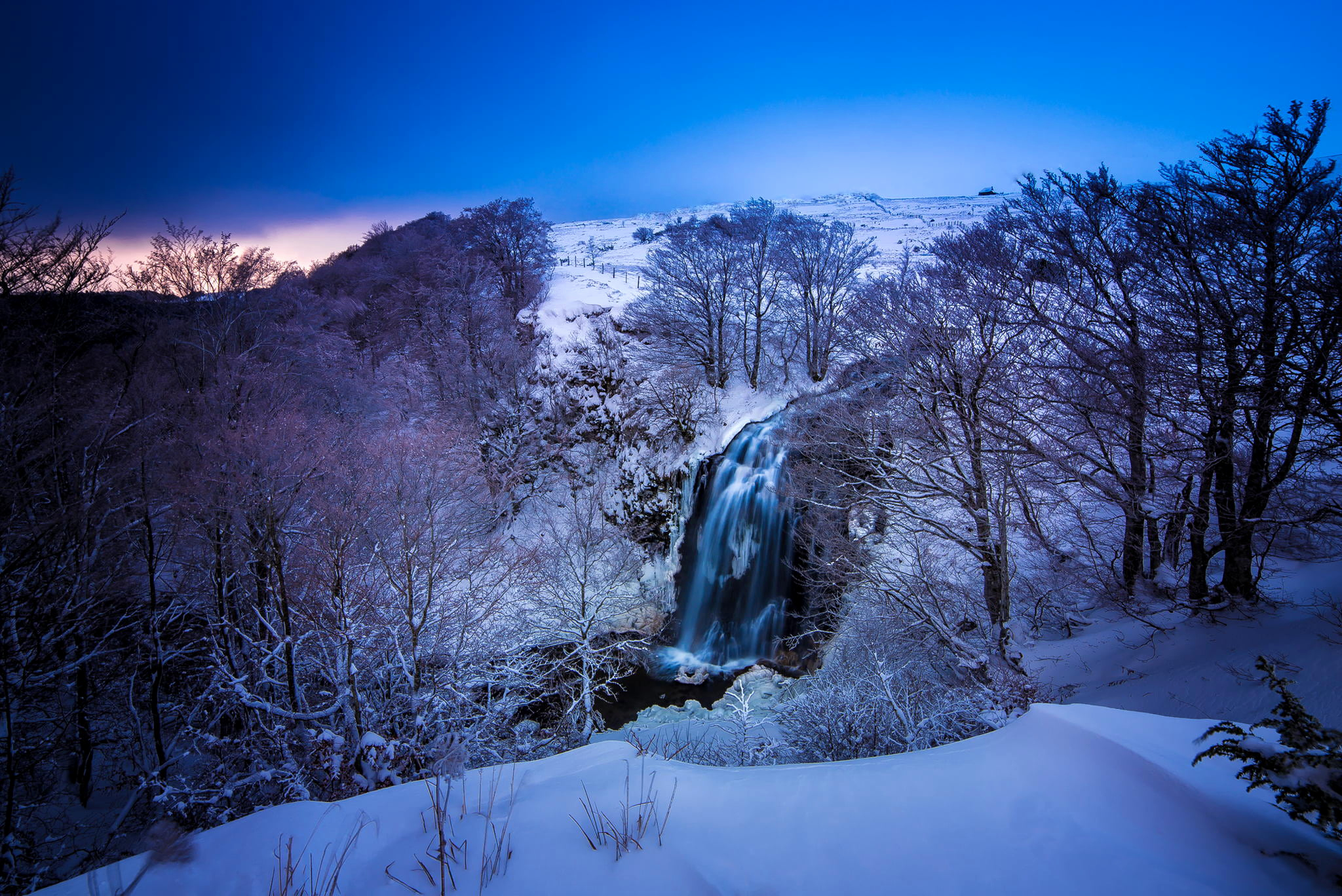 Download mobile wallpaper Winter, Waterfalls, Snow, Waterfall, Forest, Tree, Earth for free.