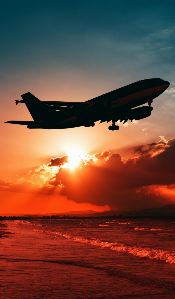Download mobile wallpaper Sunset, Sky, Cloud, Aircraft, Passenger Plane, Sunbeam, Vehicles, Sunbean for free.