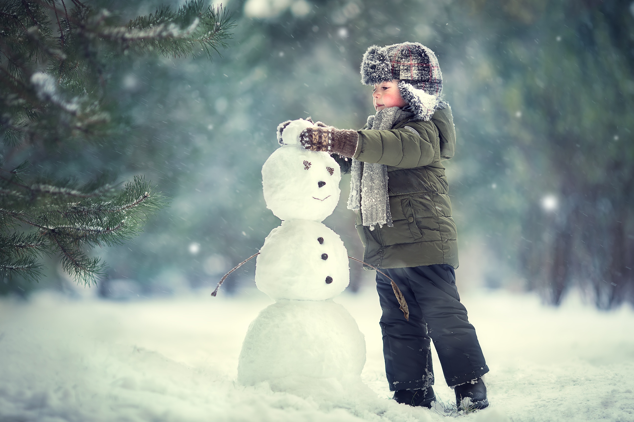 Download mobile wallpaper Winter, Snowman, Child, Hat, Photography, Depth Of Field, Little Boy for free.