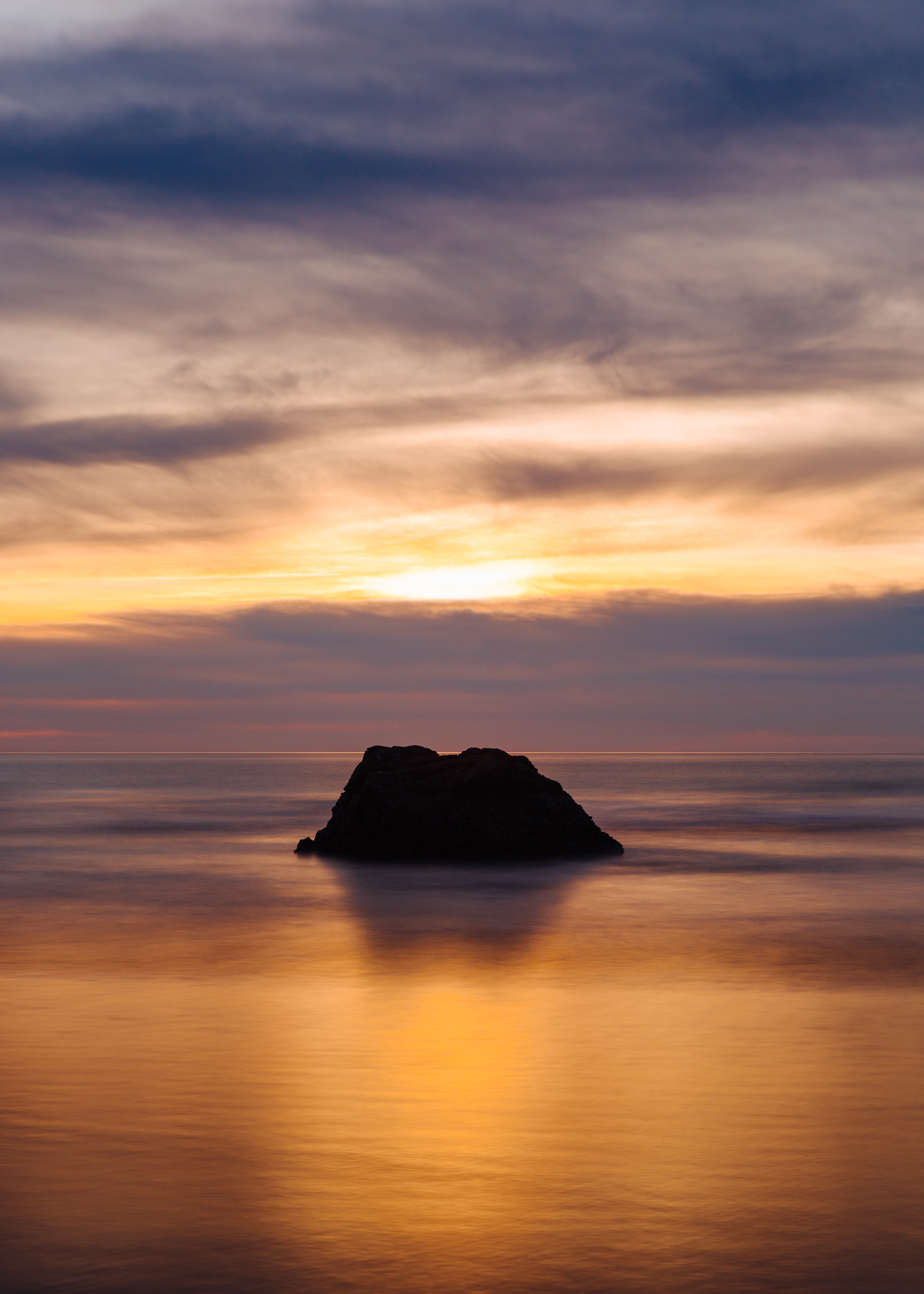 Download mobile wallpaper Rock, Horizon, Ocean, Sunset, Nature for free.