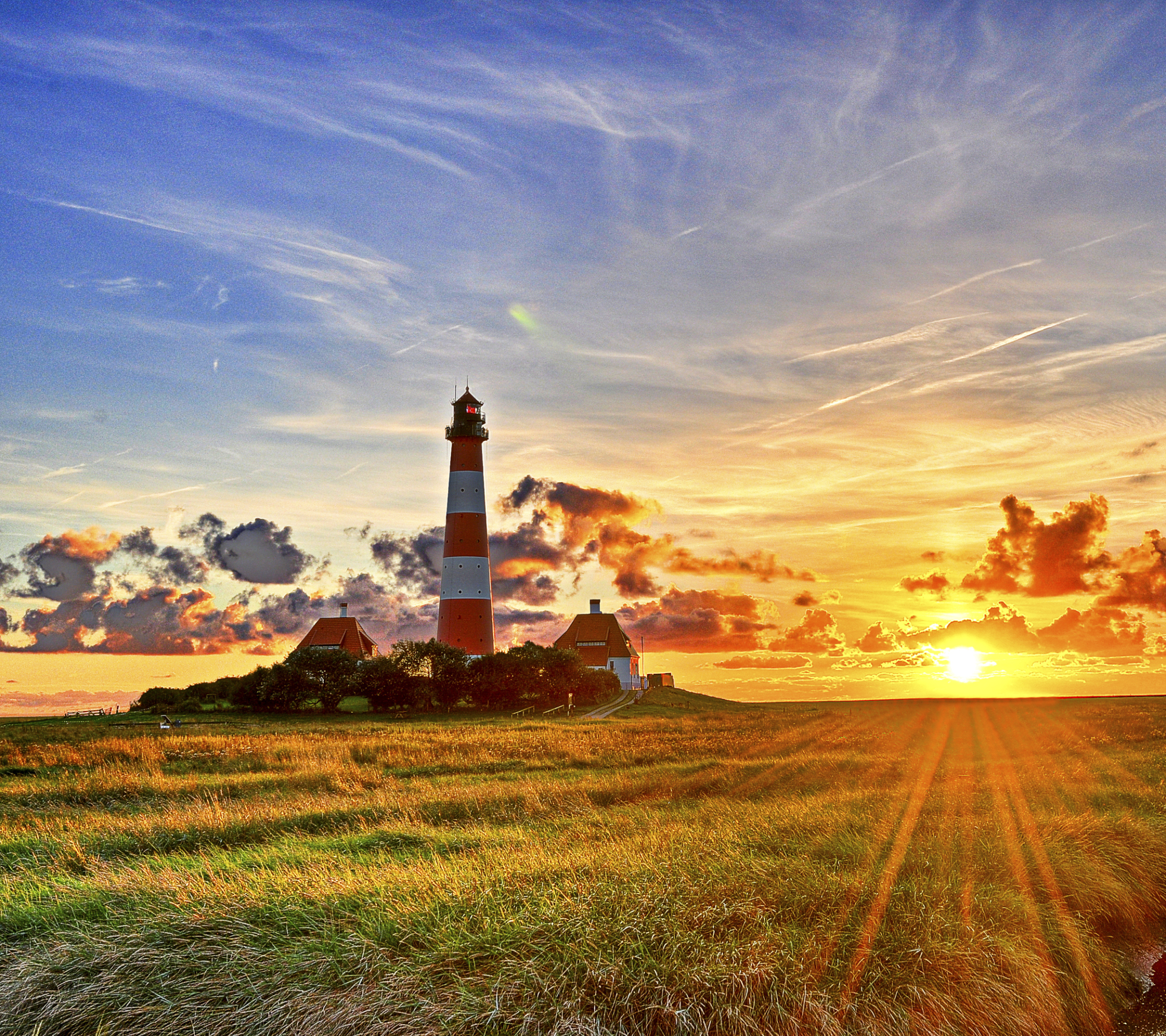 Download mobile wallpaper Sunset, Sky, Horizon, Lighthouse, Sunbeam, Man Made, Sunbean for free.