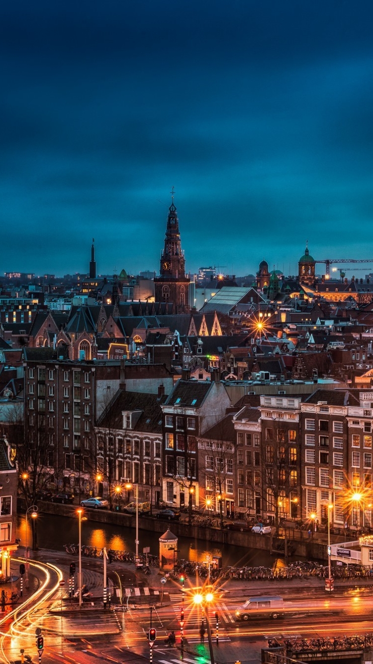 Скачать картинку Города, Ночь, Улица, Нидерланды, Амстердам, Сделано Человеком в телефон бесплатно.