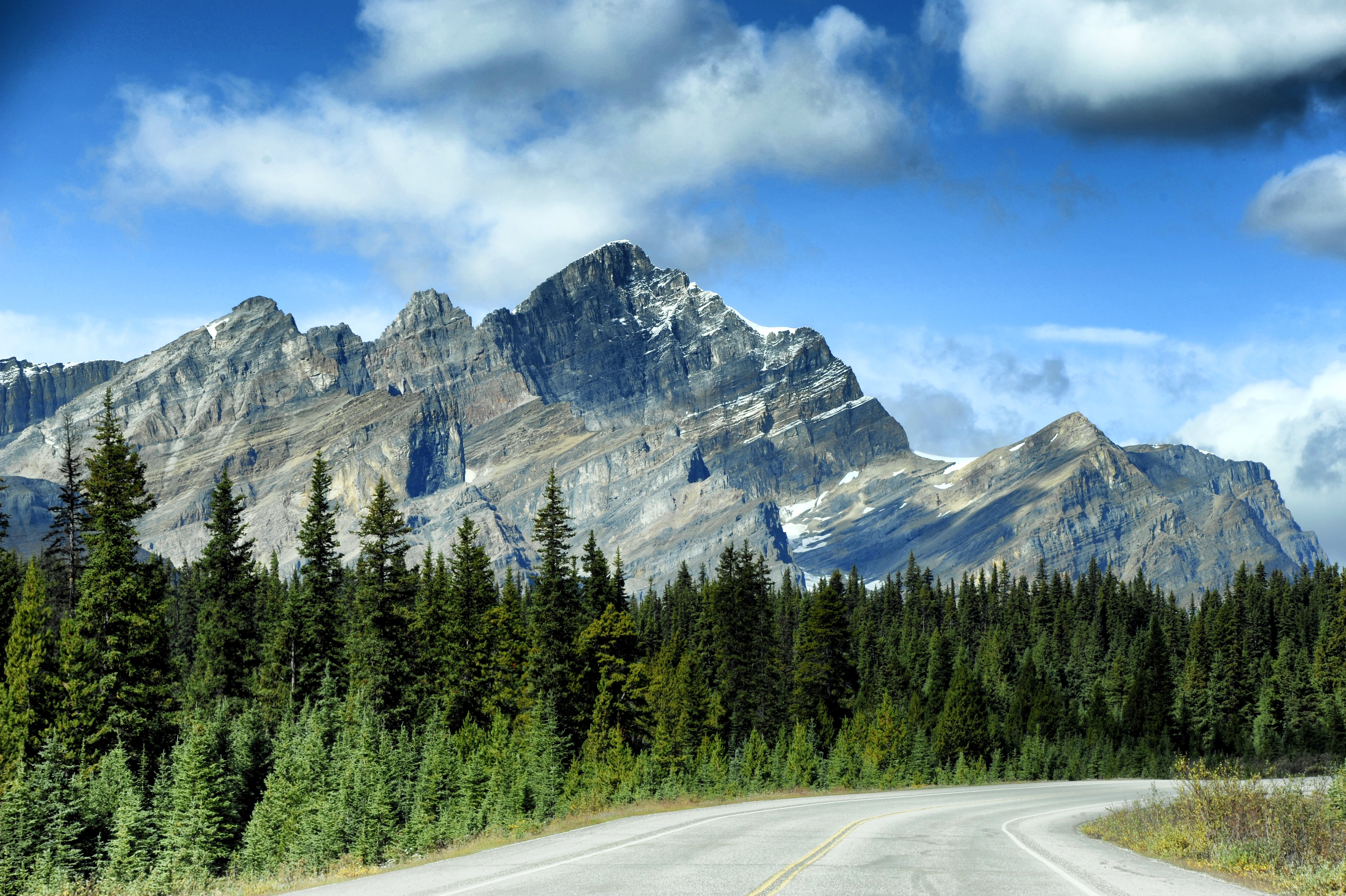 Free download wallpaper Trees, Sky, Rocks, Road, Spruce, Fir, Nature, Mountains on your PC desktop