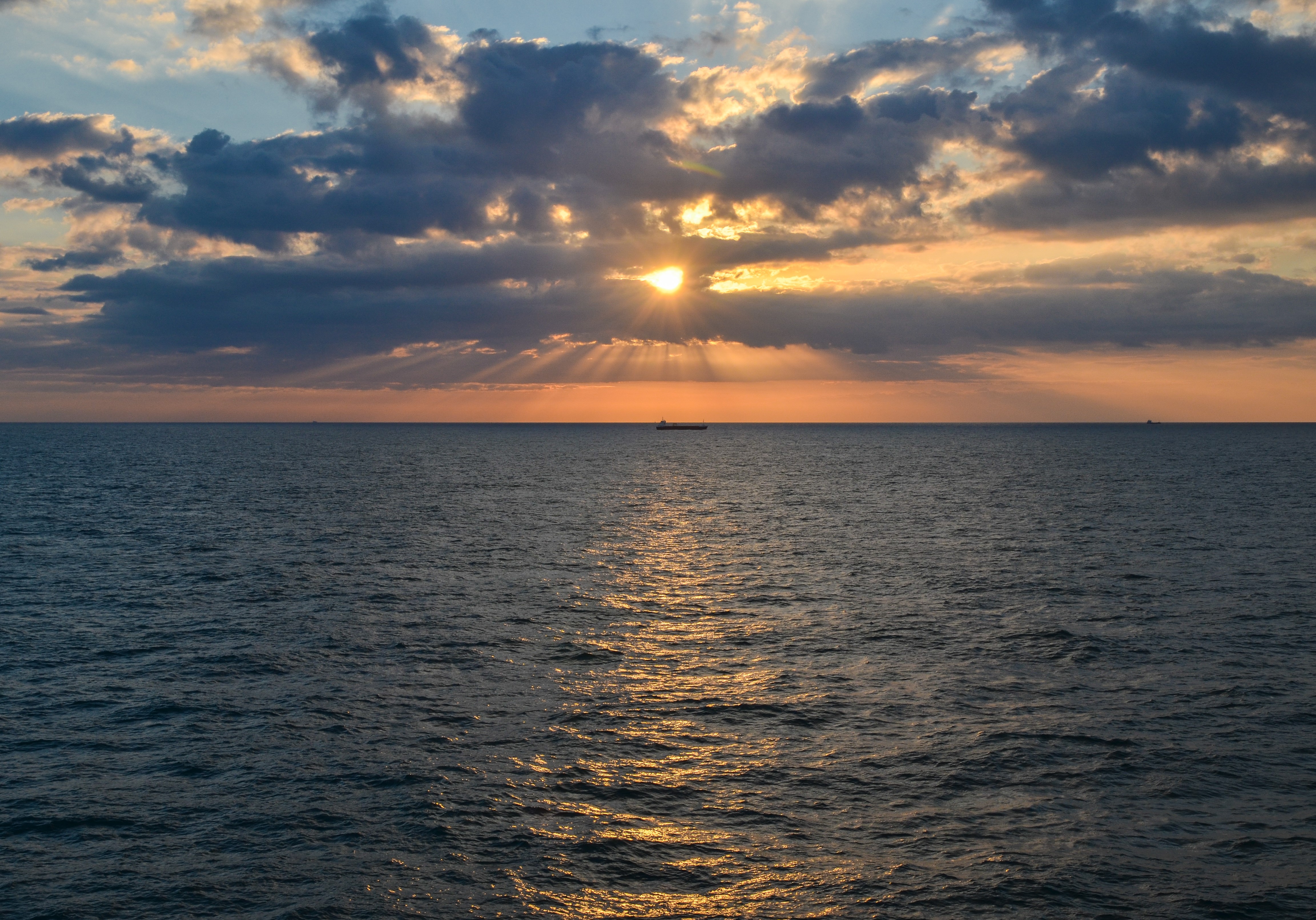 Free download wallpaper Sunset, Horizon, Ripple, Ripples, Nature, Sea, Waves, Ship on your PC desktop