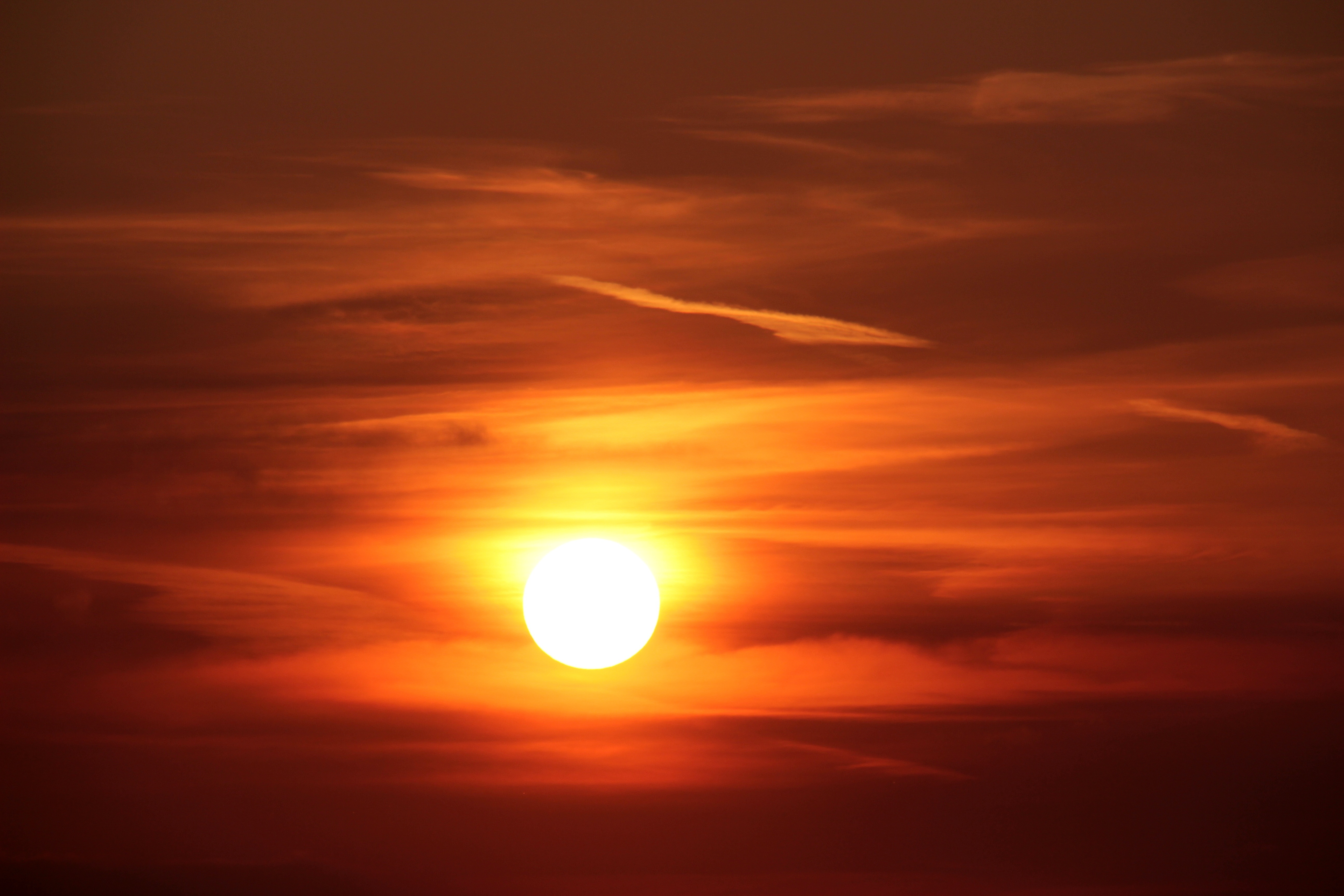 Download mobile wallpaper Nature, Sunset, Sky, Sun, Earth, Evening, Orange (Color) for free.