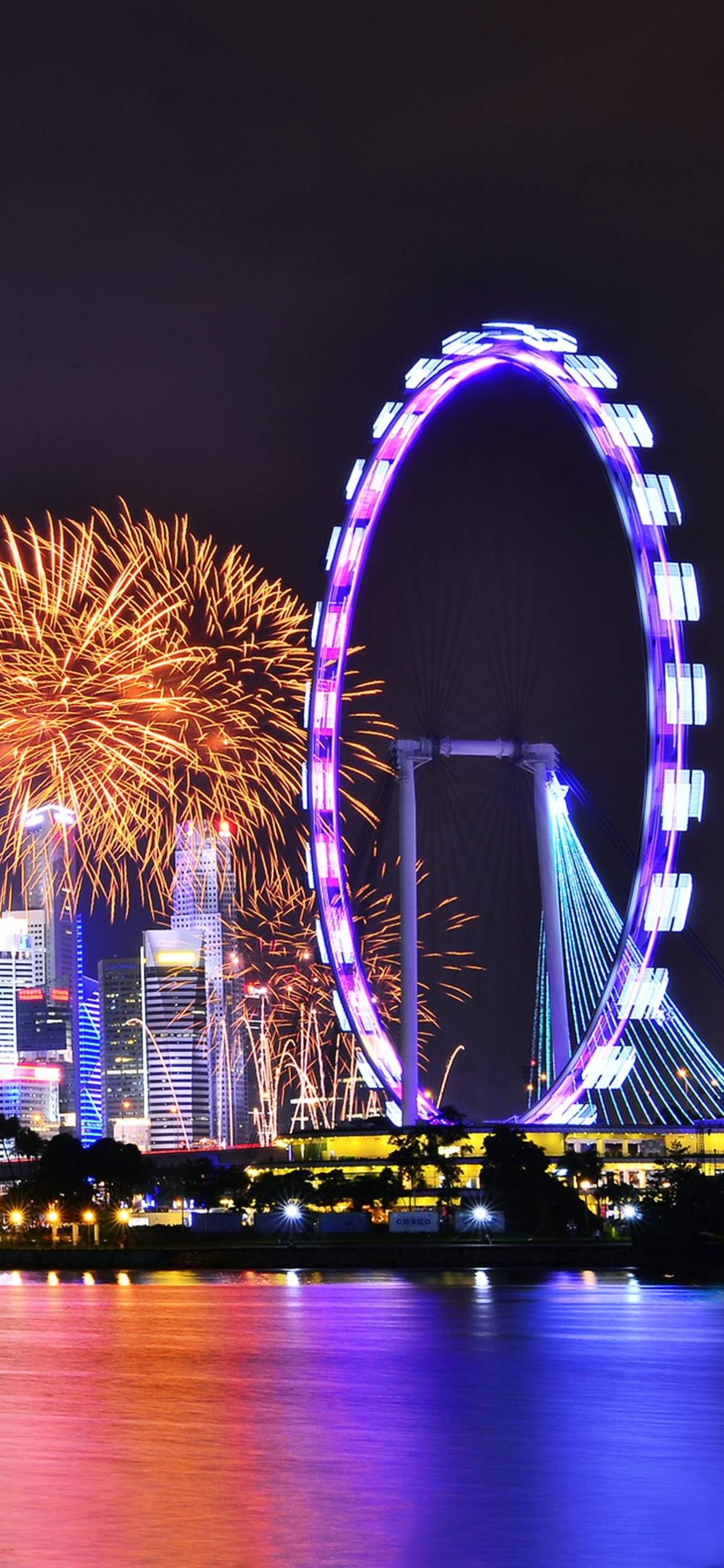 Handy-Wallpaper Städte, Wolkenkratzer, Gebäude, Licht, Singapur, Feuerwerk, Feier, Nacht, Menschengemacht kostenlos herunterladen.