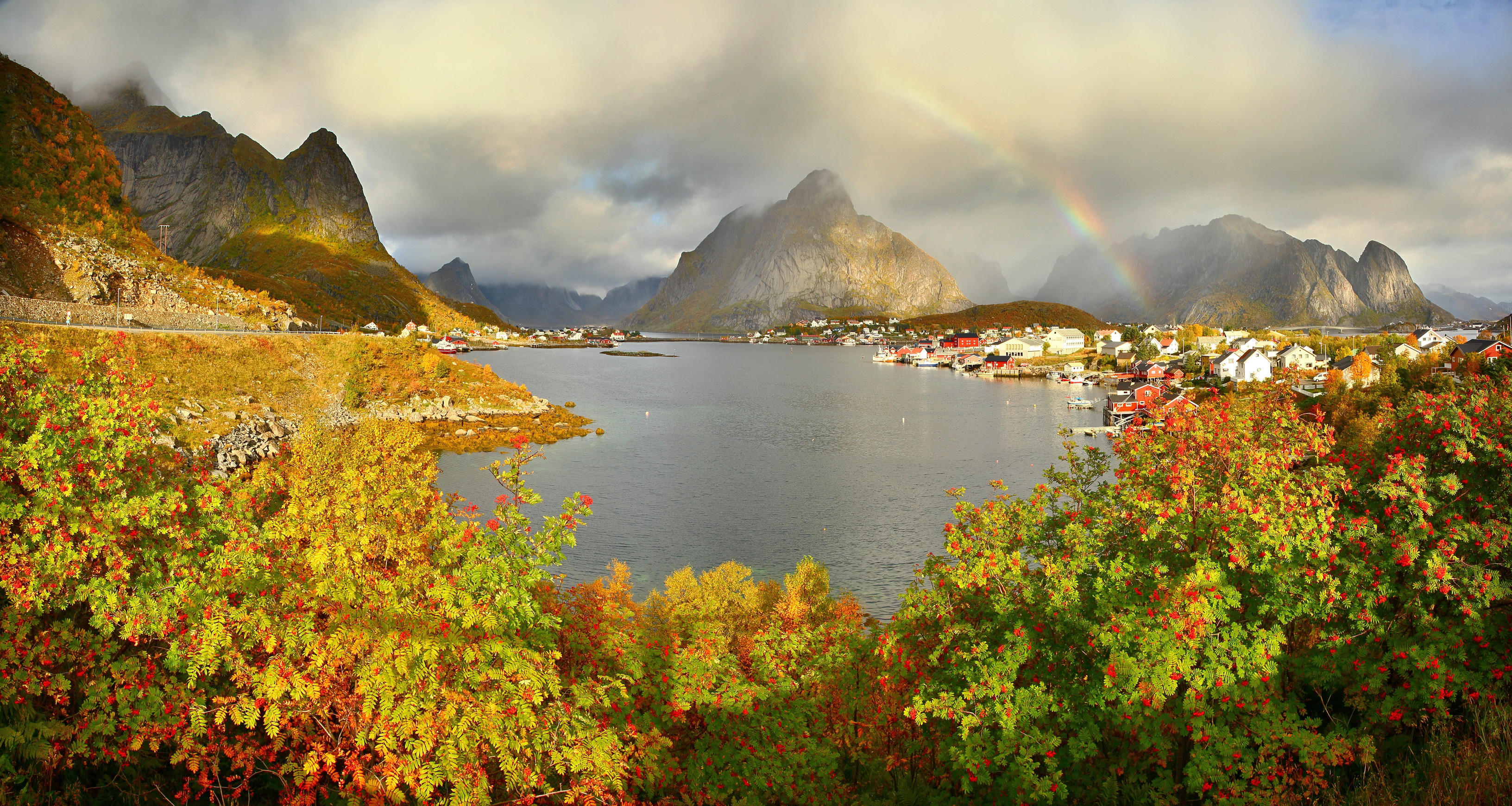 Download mobile wallpaper Landscape, Rainbow, Mountain, Lake, Village, Norway, Lofoten, Man Made, Reine for free.