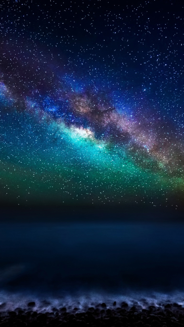 Download mobile wallpaper Sky, Stars, Night, Ocean, Starry Sky, Earth, Milky Way for free.