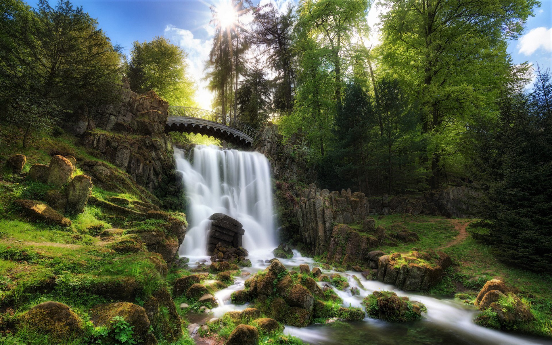 Download mobile wallpaper Waterfalls, Waterfall, Forest, Tree, Earth, Bridge, Moss for free.