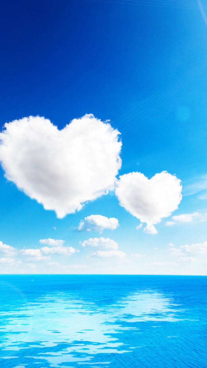 Скачать картинку Облака, Любовь, Океан, Сердце, Облако, Художественные в телефон бесплатно.