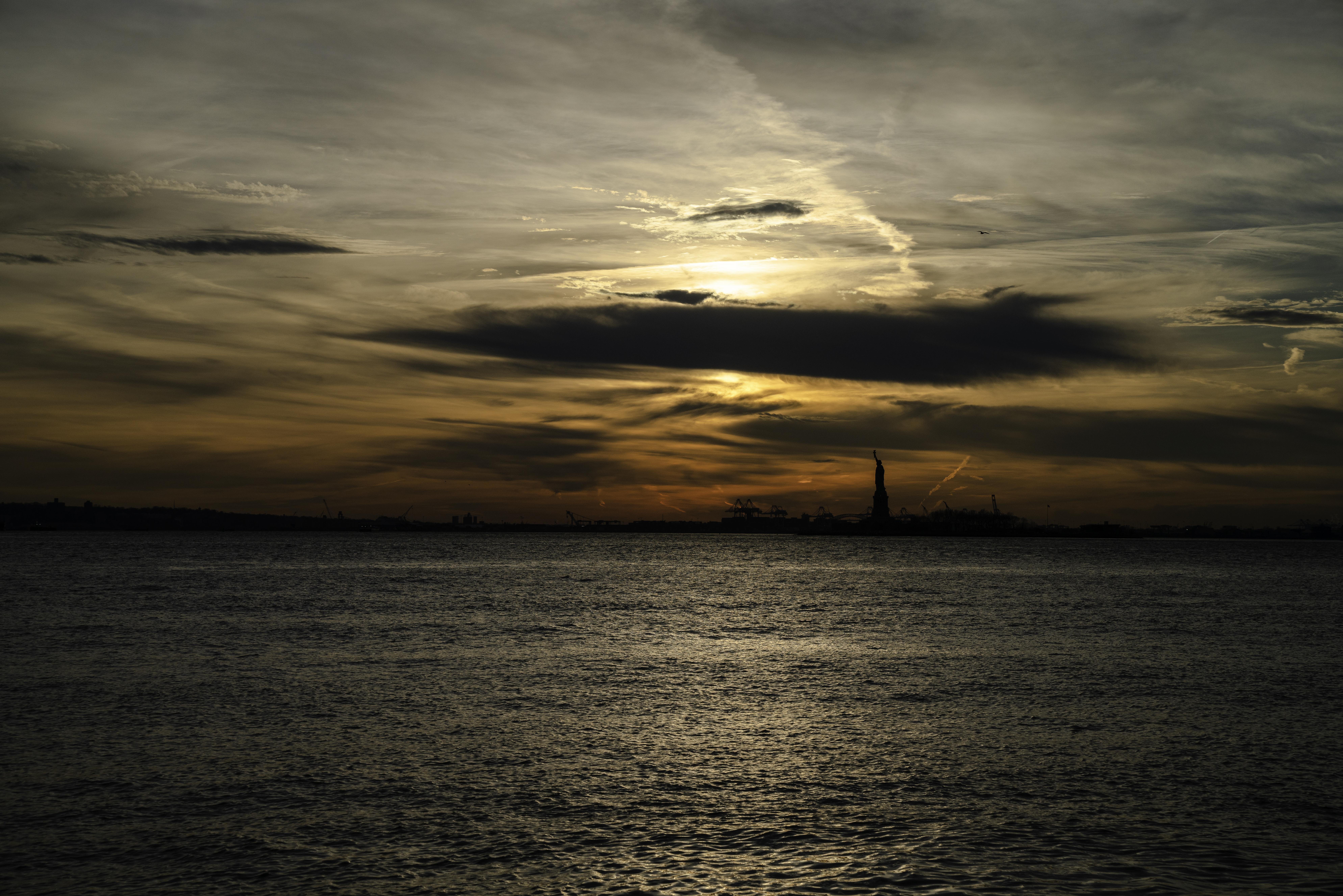 Download mobile wallpaper Sunset, Water, Silhouette, Statue Of Liberty, Dark for free.