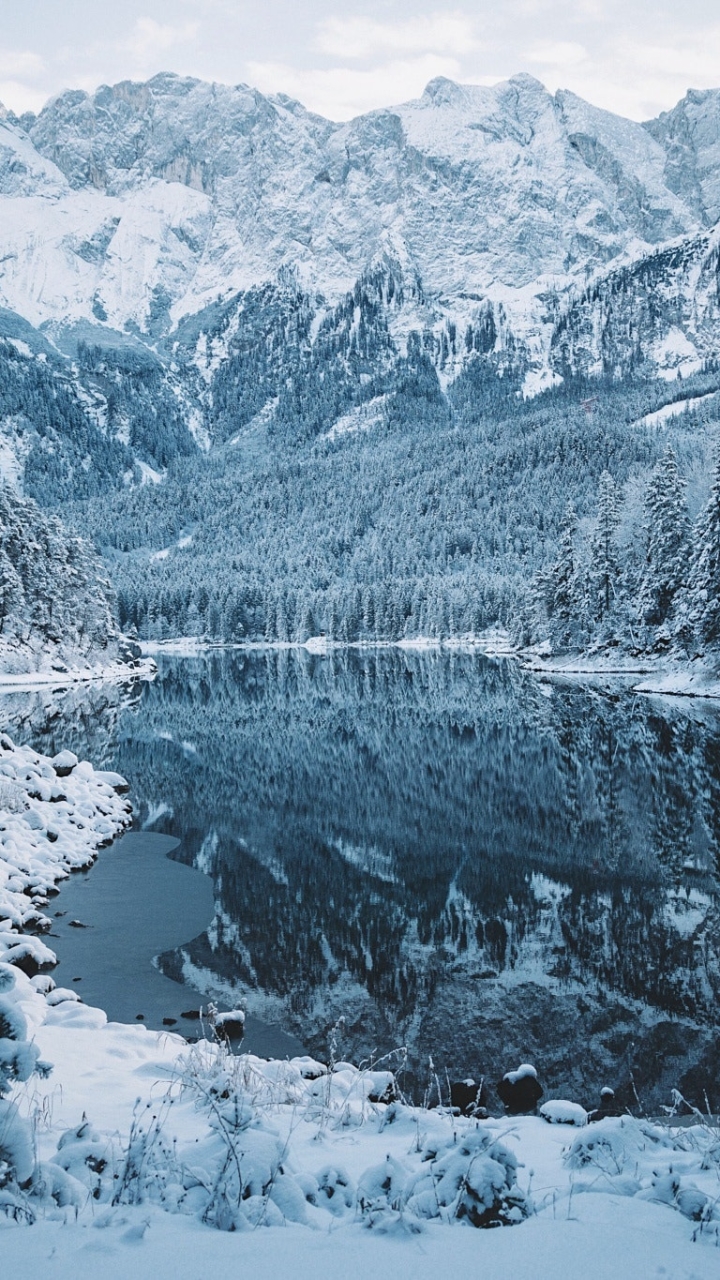 Download mobile wallpaper Winter, Nature, Snow, Lakes, Mountain, Lake, Reflection, Forest, Earth for free.