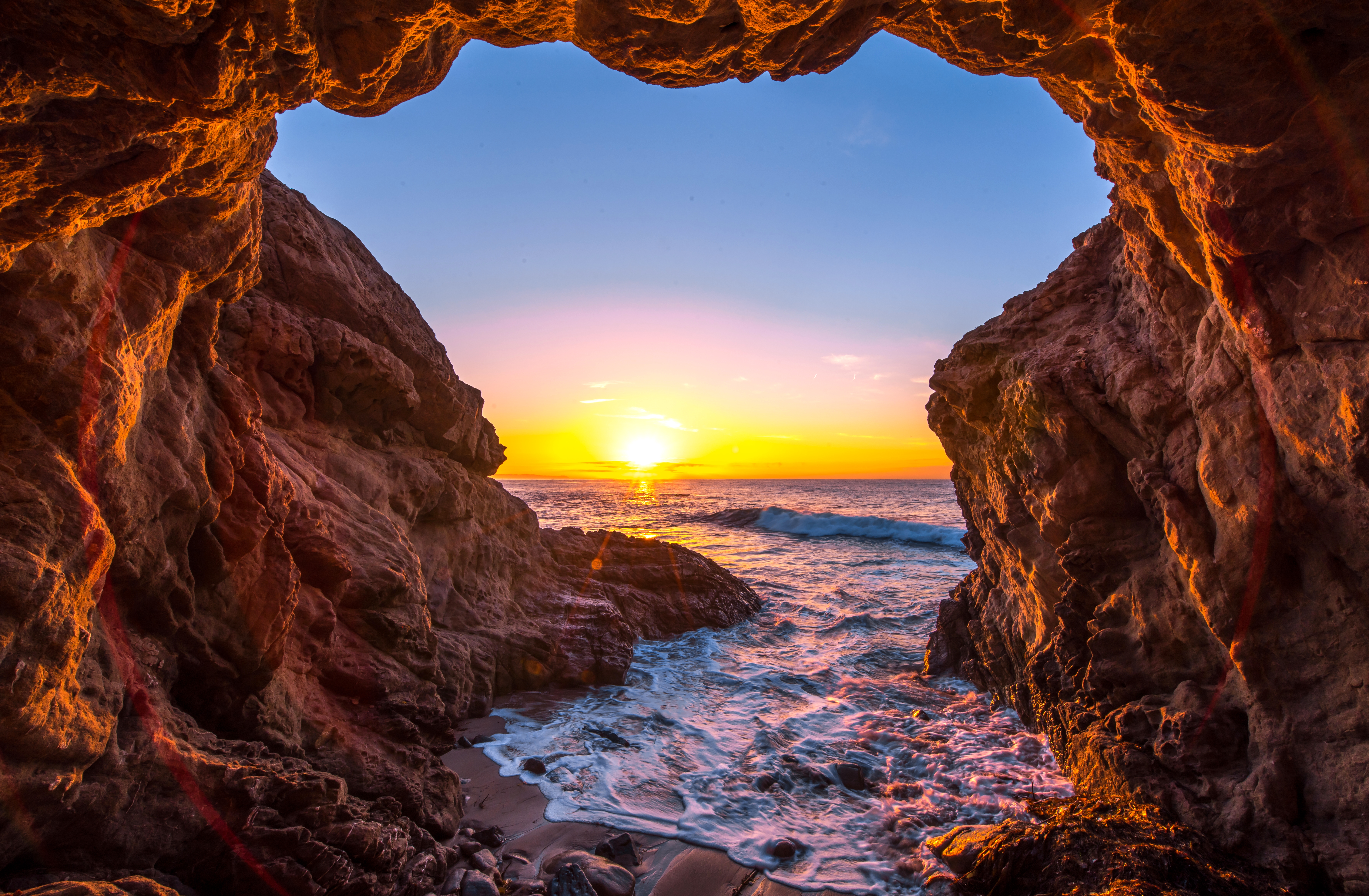 Free download wallpaper Sunset, Sea, Sun, Caves, Horizon, Ocean, Earth, Cave on your PC desktop