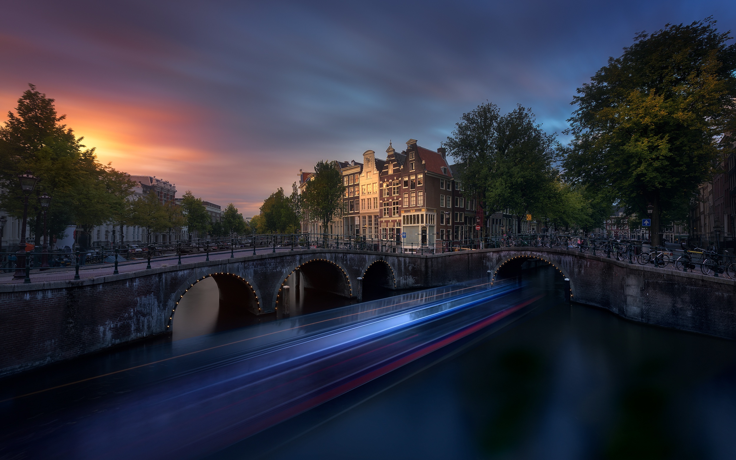 Download mobile wallpaper Cities, City, Building, Evening, Netherlands, Amsterdam, Man Made, Time Lapse, Canal for free.