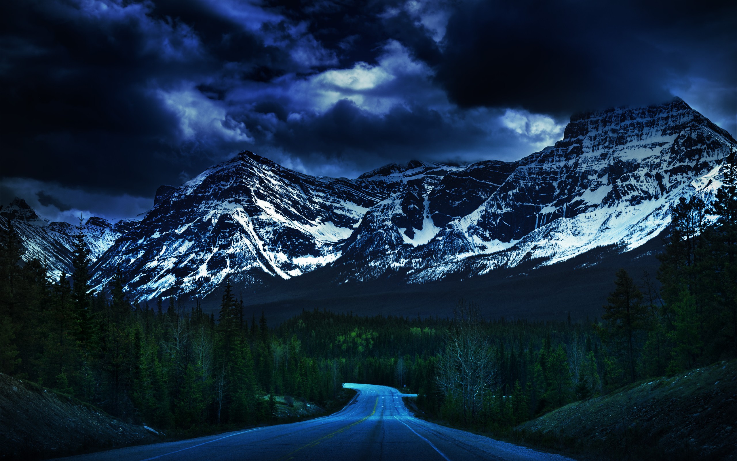 Download mobile wallpaper Sky, Mountain, Dark, Road, Forest, Tree, Cloud, Man Made for free.