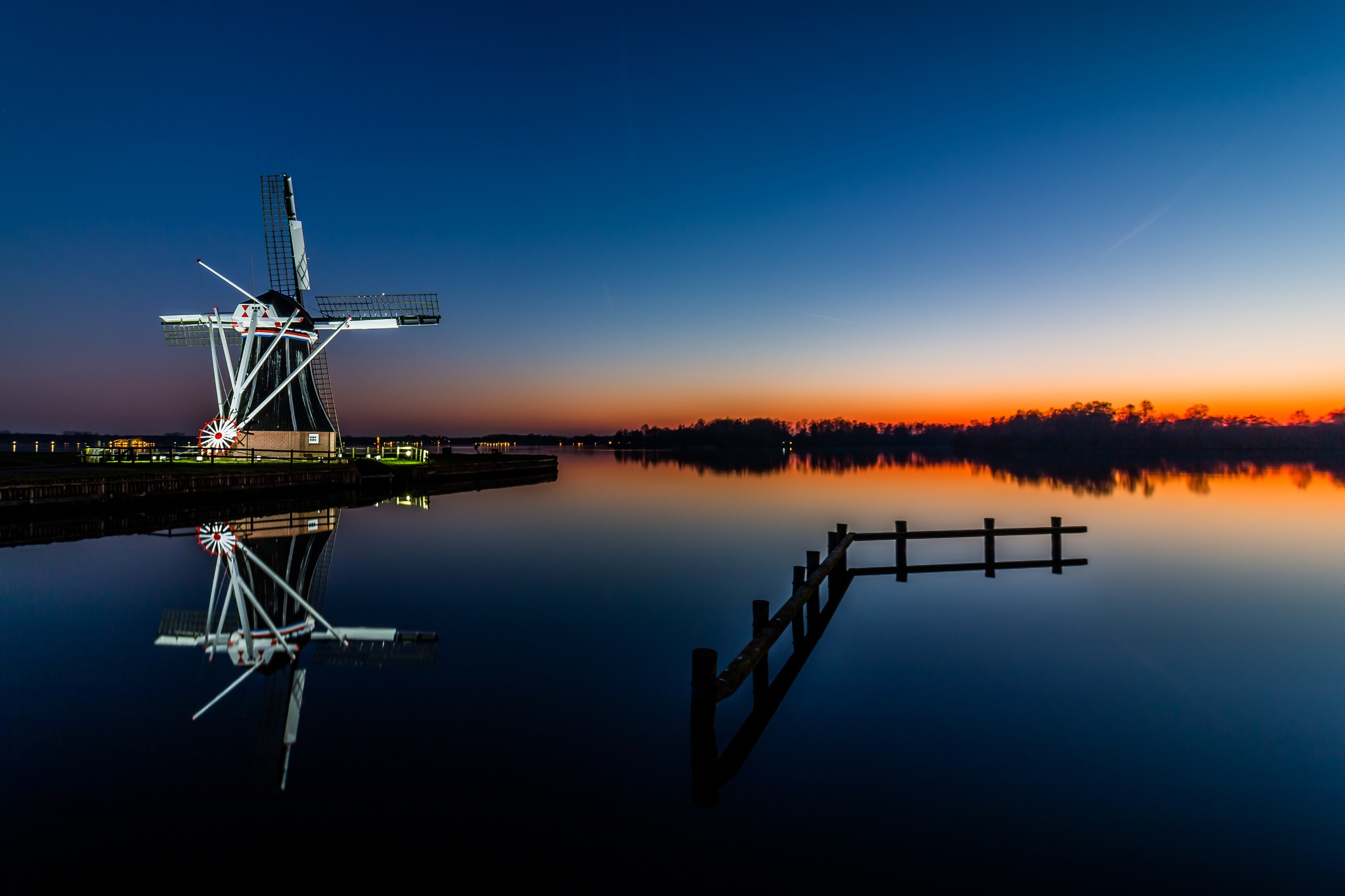 Download mobile wallpaper Building, Reflection, Sunrise, Windmill, Man Made for free.