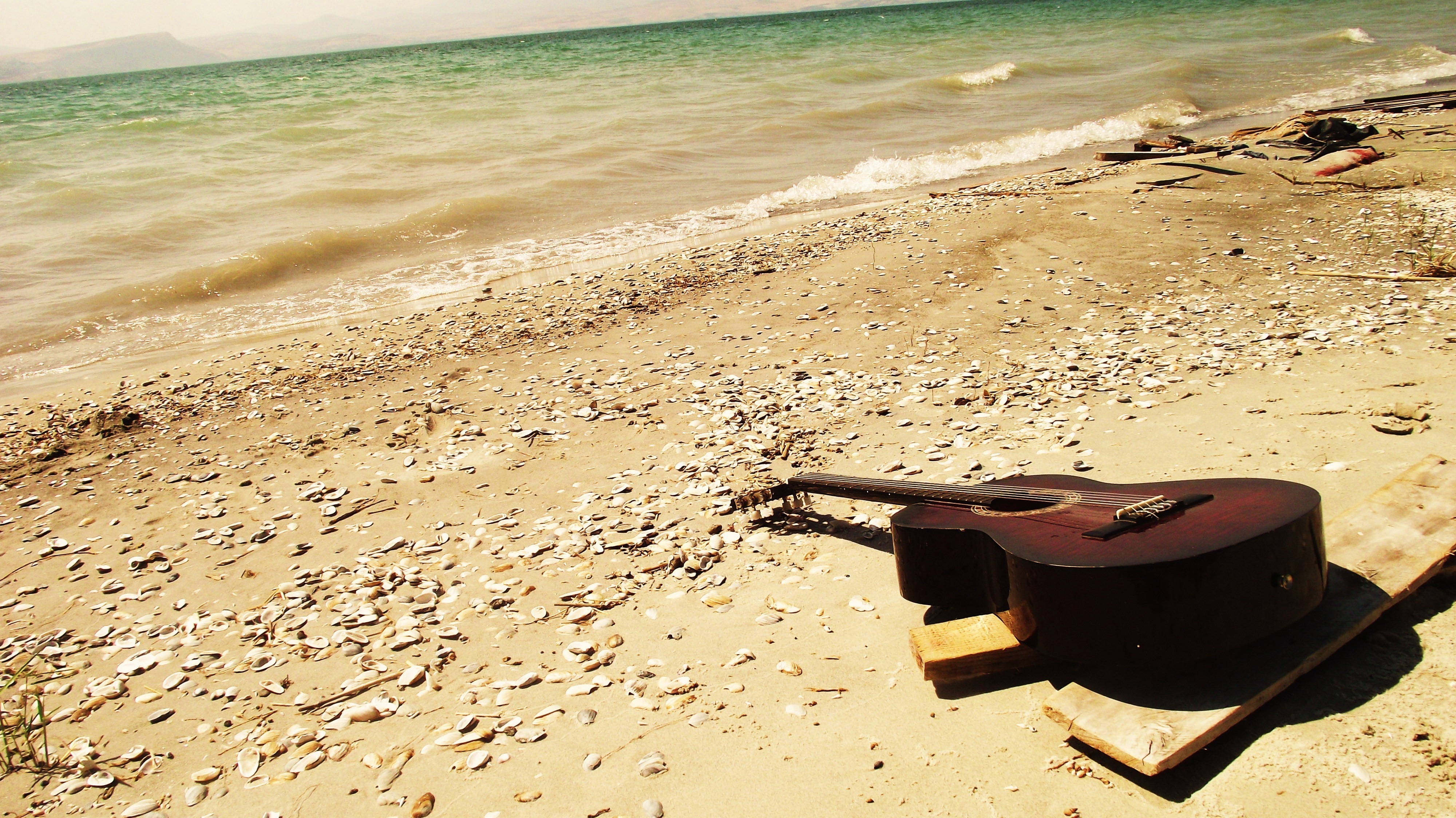 guitar, nature, stones, beach, sand, shore, bank, romance Panoramic Wallpaper