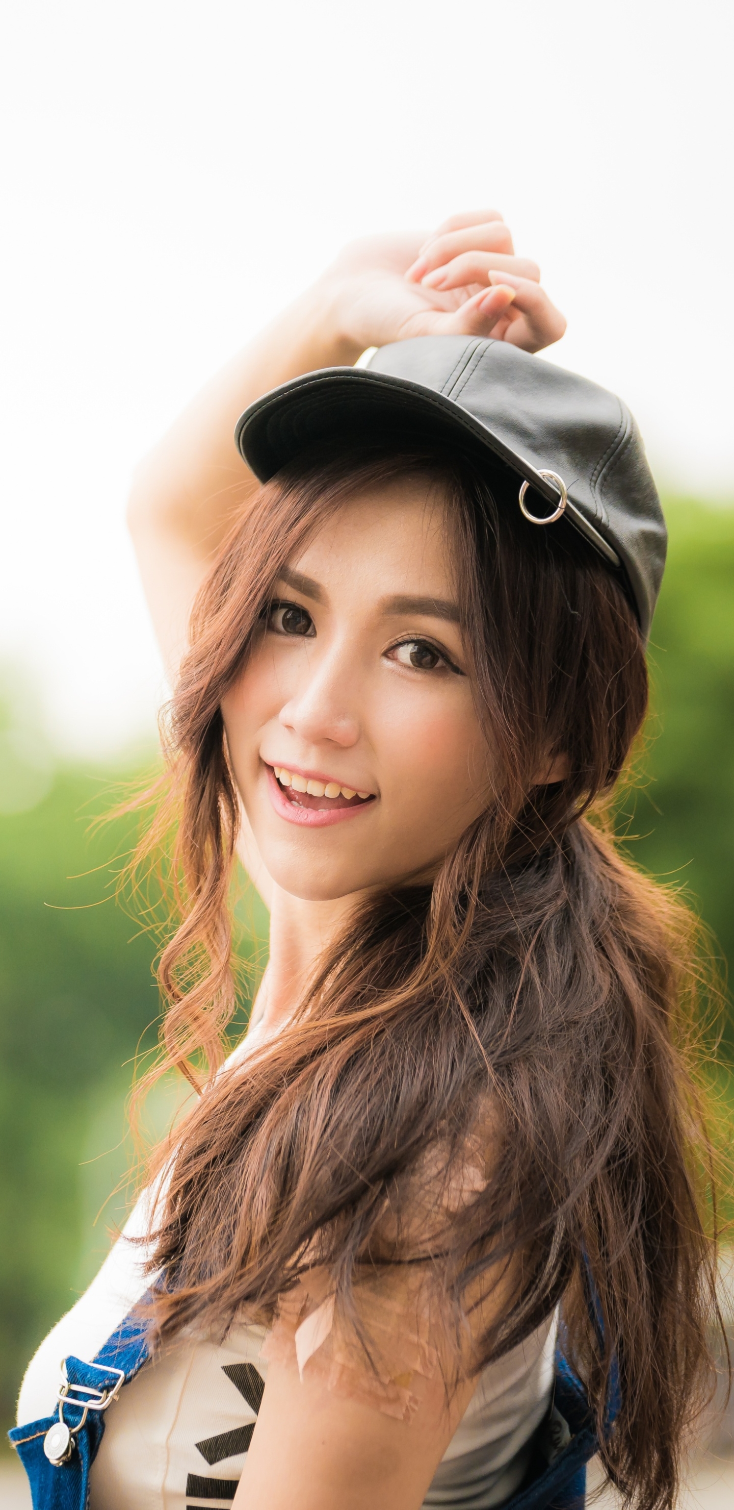 Download mobile wallpaper Smile, Cap, Brunette, Model, Women, Asian, Brown Eyes, Long Hair for free.