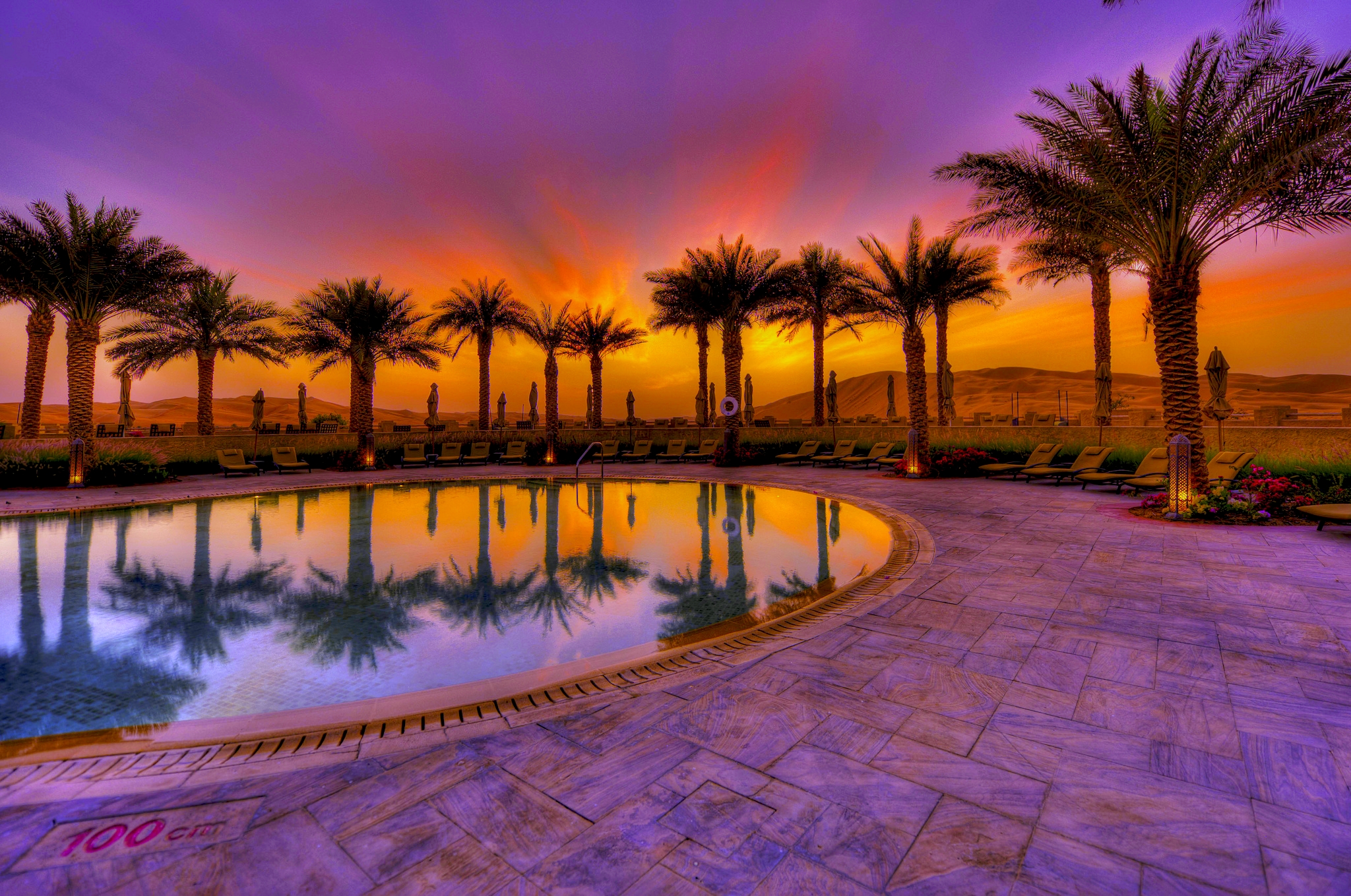 Download mobile wallpaper Sunset, Sky, Purple, Tropical, Resort, Pool, Man Made, Palm Tree for free.