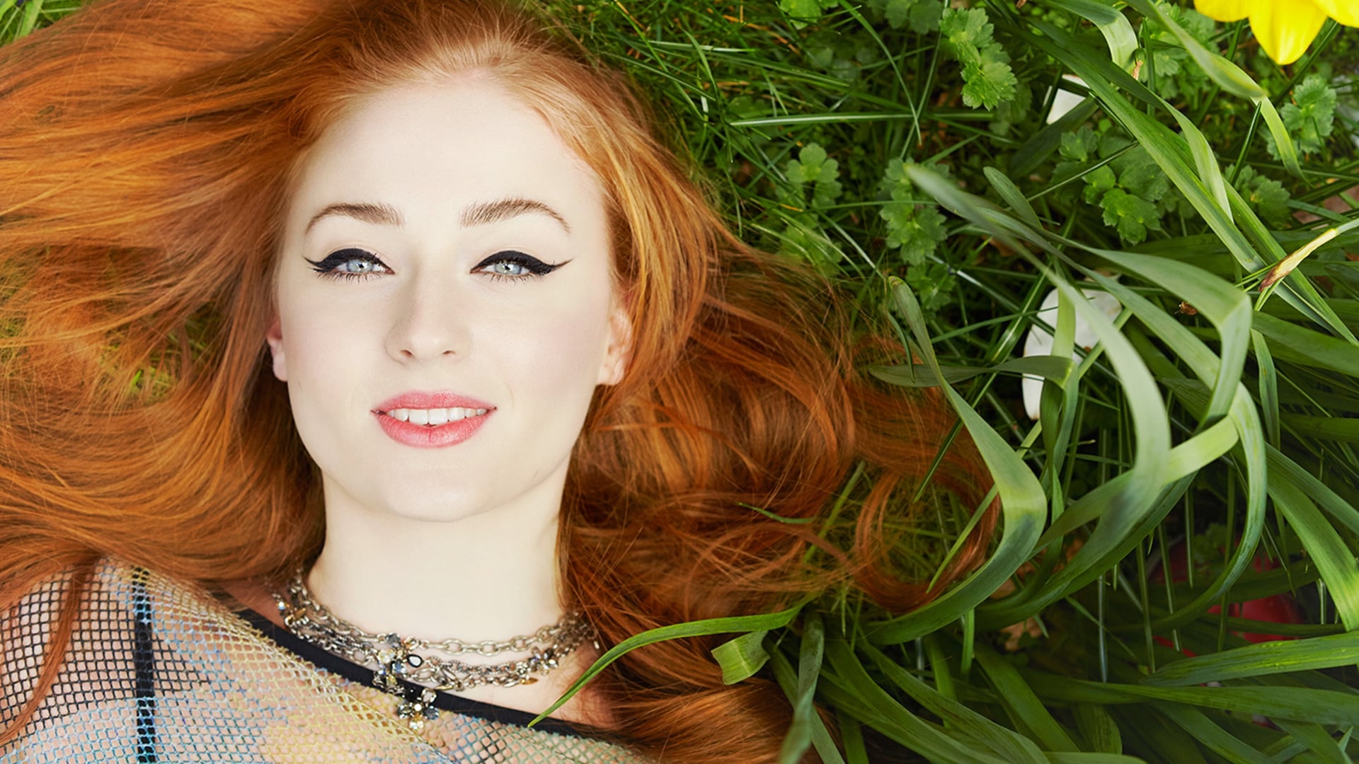 Download mobile wallpaper Smile, Redhead, Face, Blue Eyes, Celebrity, Actress, Lying Down, Sophie Turner for free.