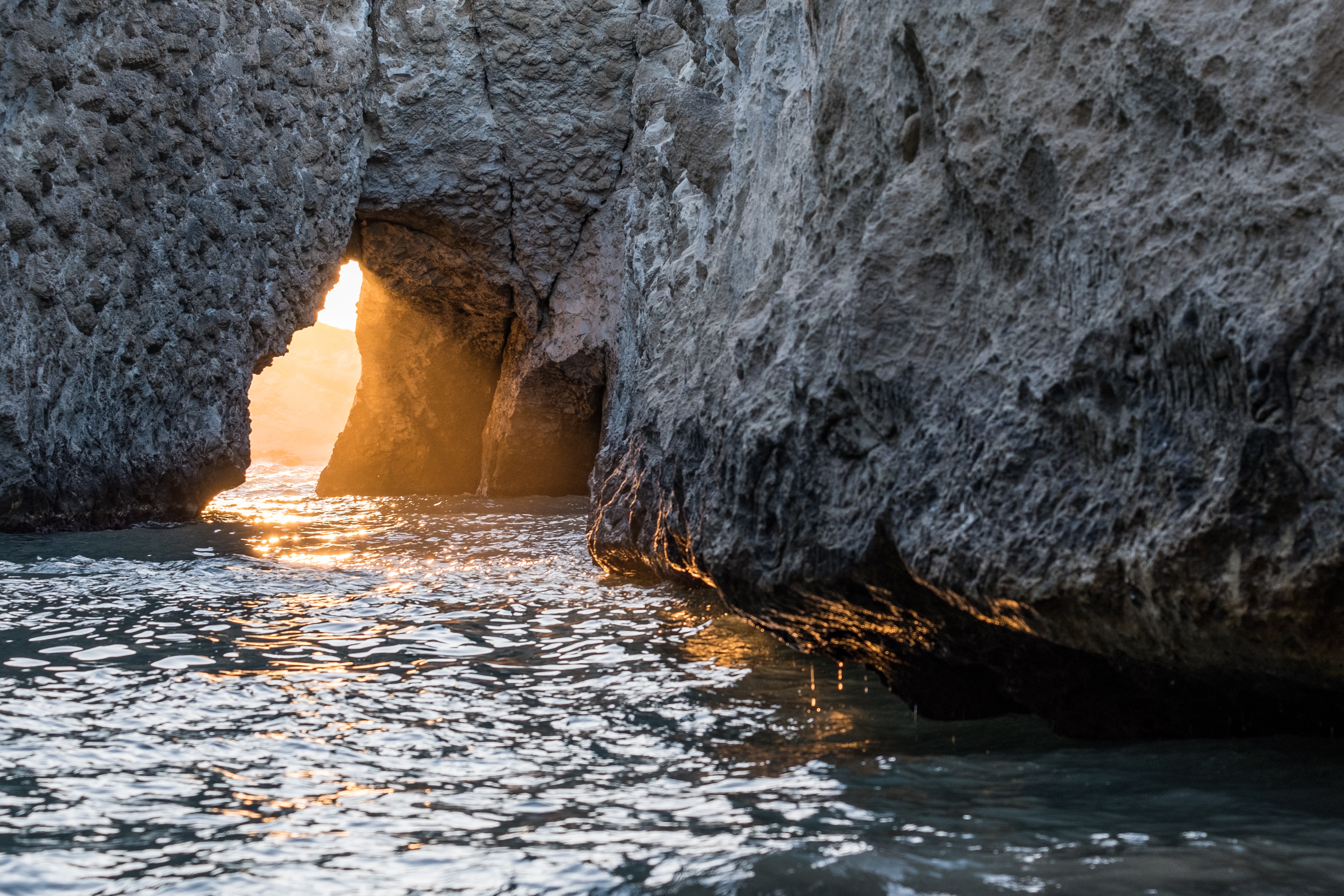 Download mobile wallpaper Rock, Sunlight, Nature, Sea, Water, Cave for free.