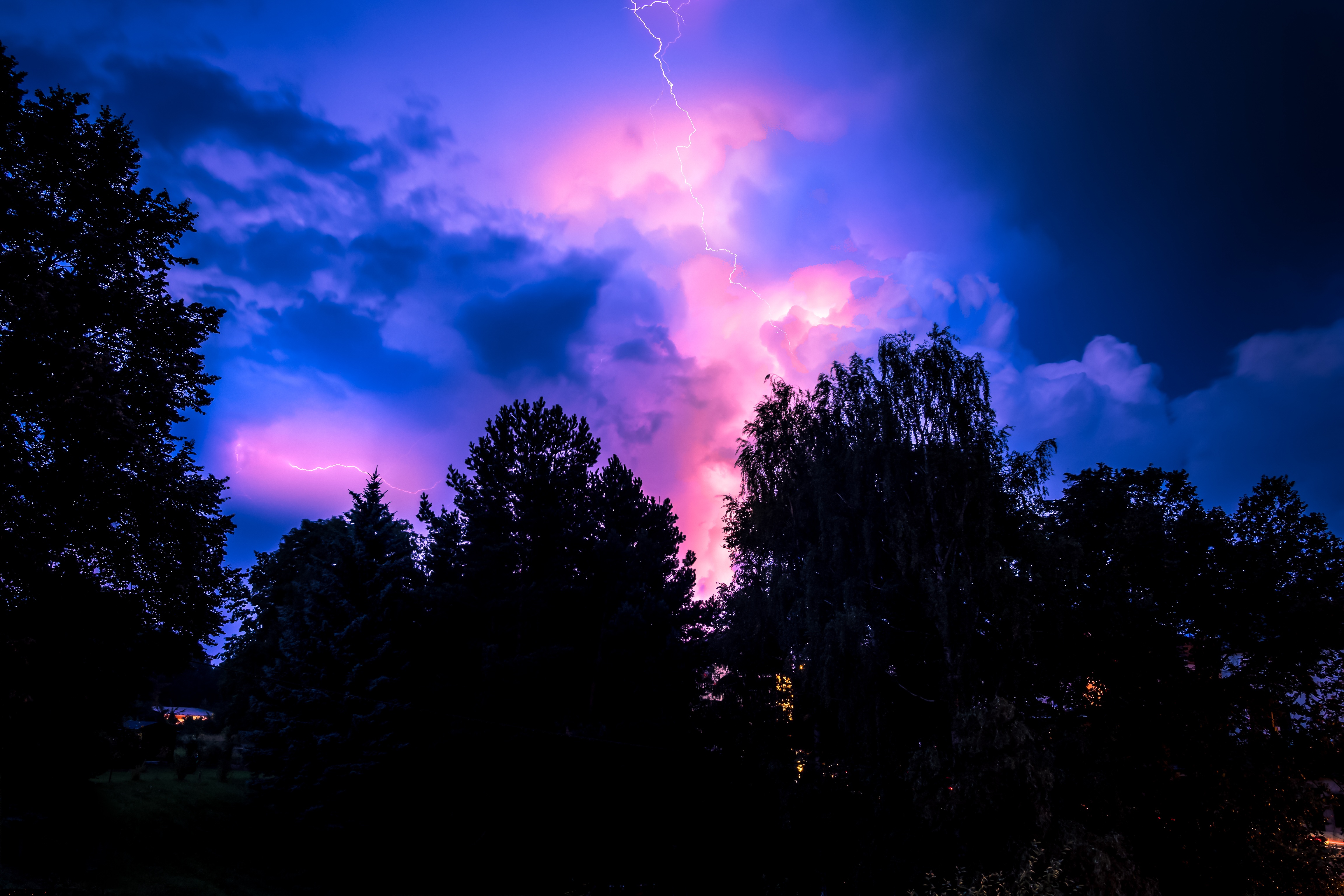 Download mobile wallpaper Sunset, Sky, Pink, Night, Lightning, Forest, Earth, Storm, Cloud for free.