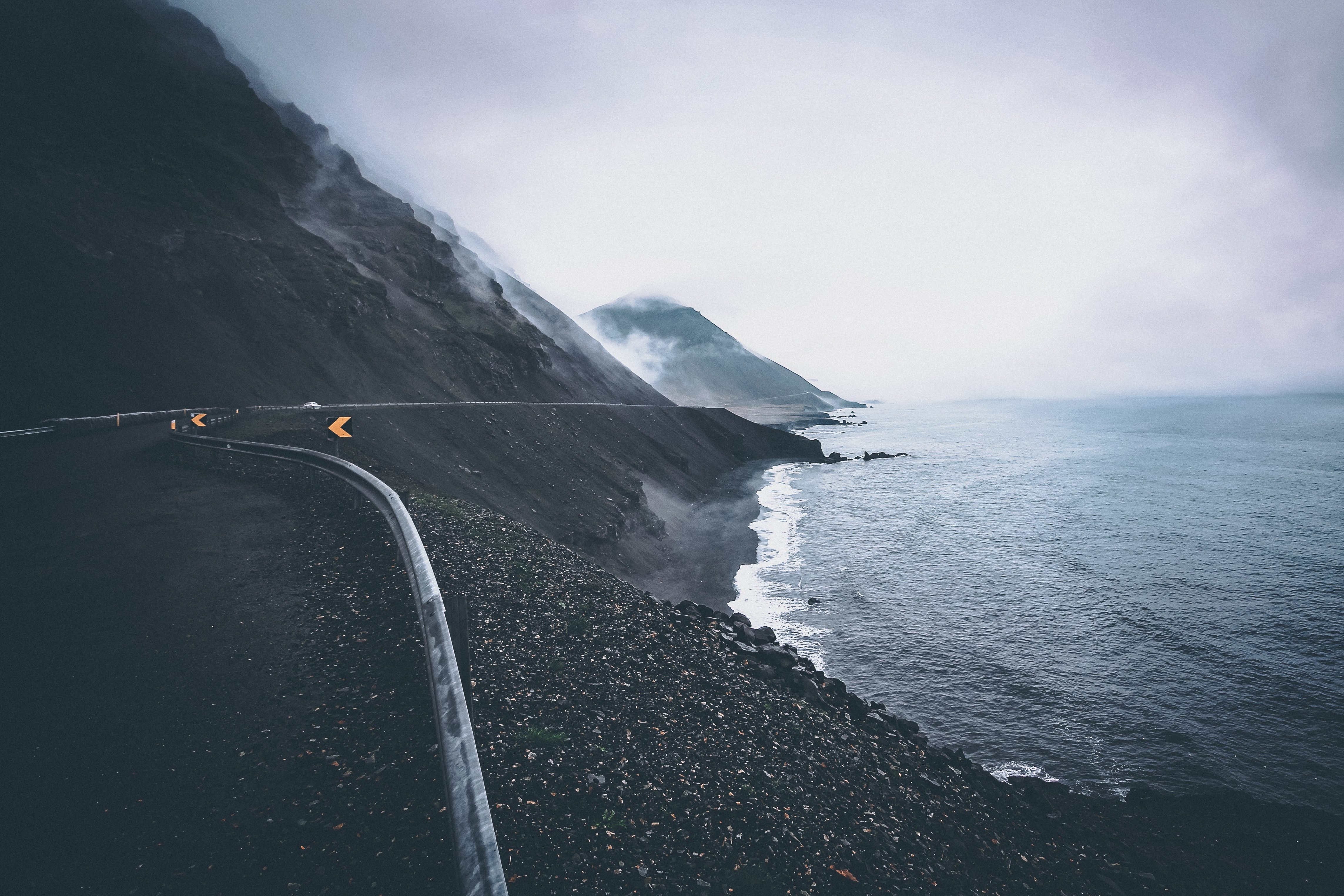 Download mobile wallpaper Fog, Mountains, Road, Sea, Nature, Coast for free.