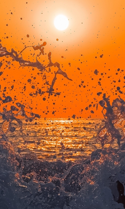 Download mobile wallpaper Sunset, Sea, Sun, Splash, Earth, Wave for free.