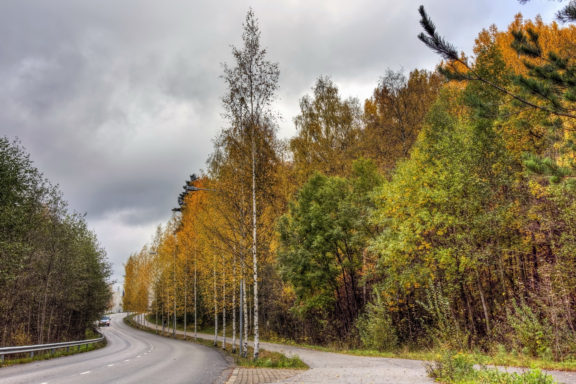 Download mobile wallpaper Road, Asphalt, Overcast, Mainly Cloudy, Forest, Trees, Nature, Auto, Finland, Autumn for free.