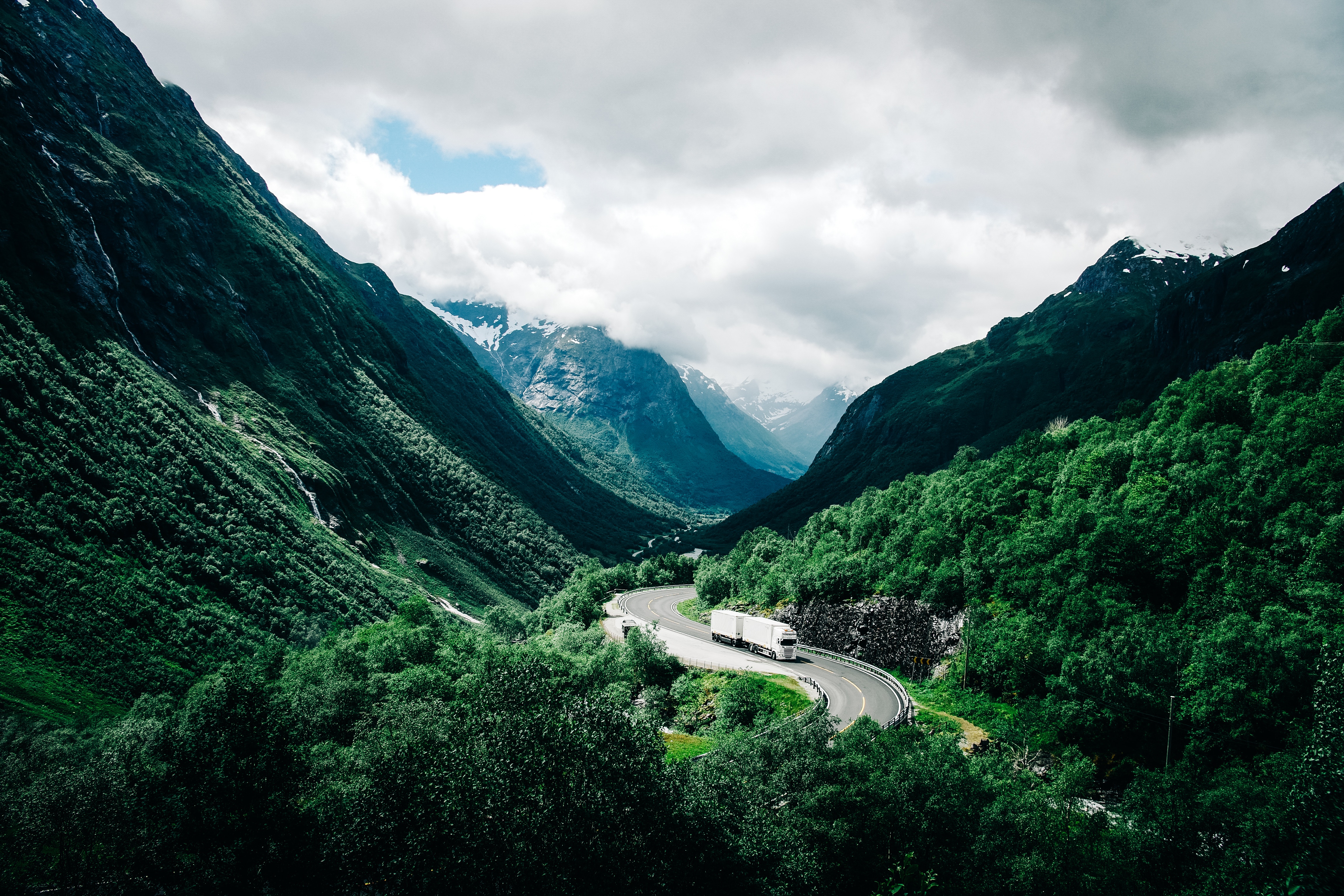 Download mobile wallpaper Clouds, Road, Norway, Nature, Car, Mountains for free.