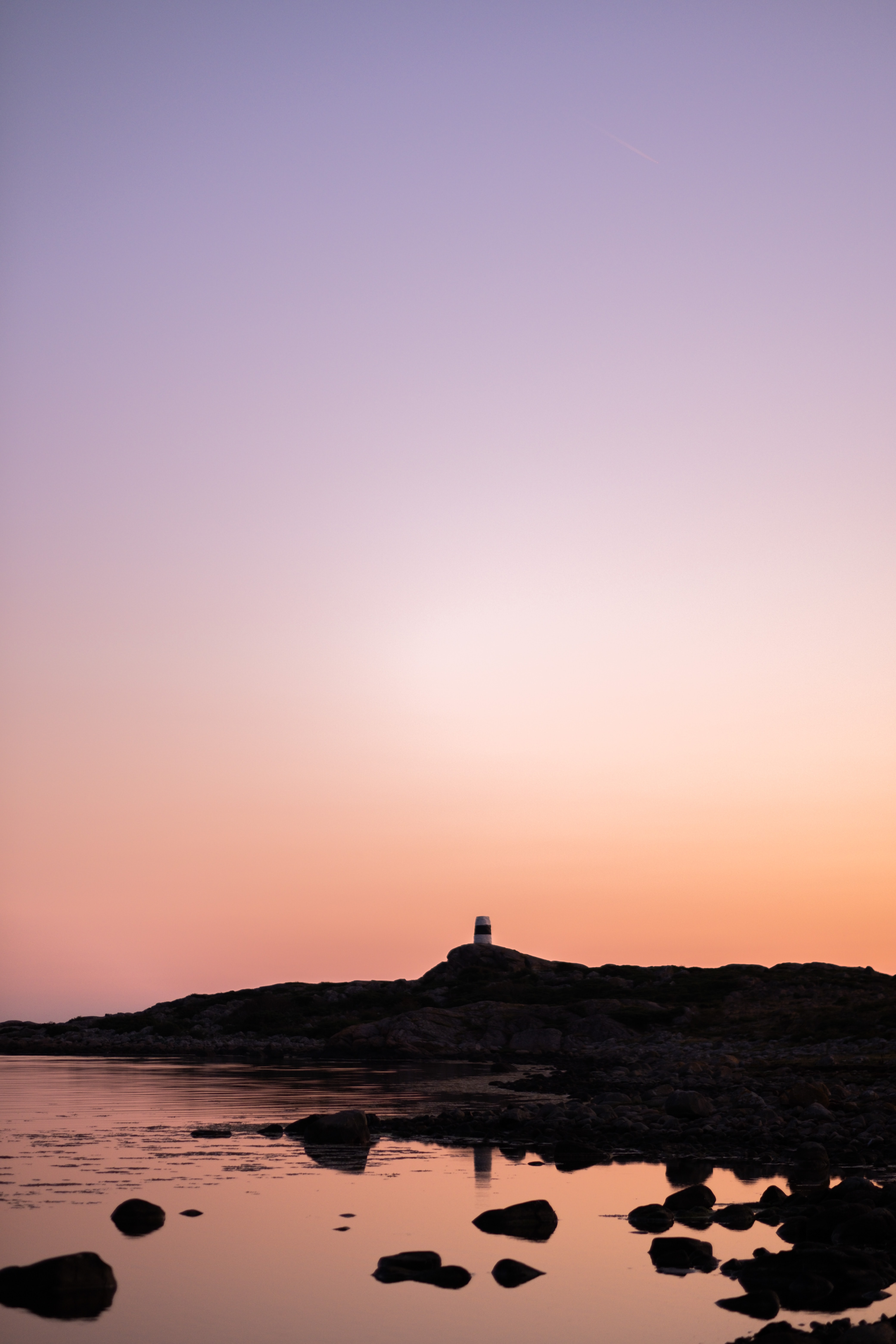 Free download wallpaper Nature, Sunset, Twilight, Rocks, Dusk, Sea, Lighthouse on your PC desktop