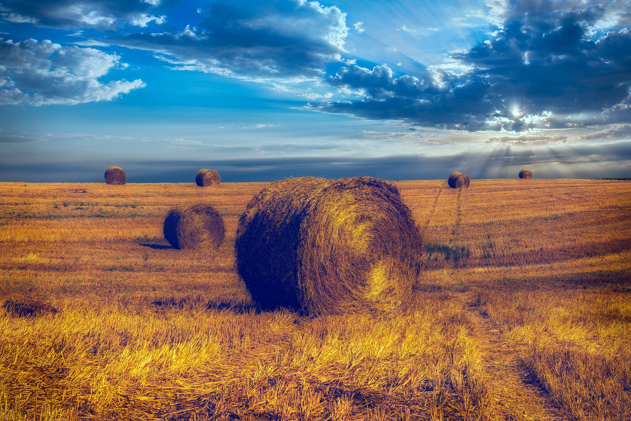 Download mobile wallpaper Nature, Sky, Summer, Earth, Field, Cloud, Sunbeam, Haystack for free.