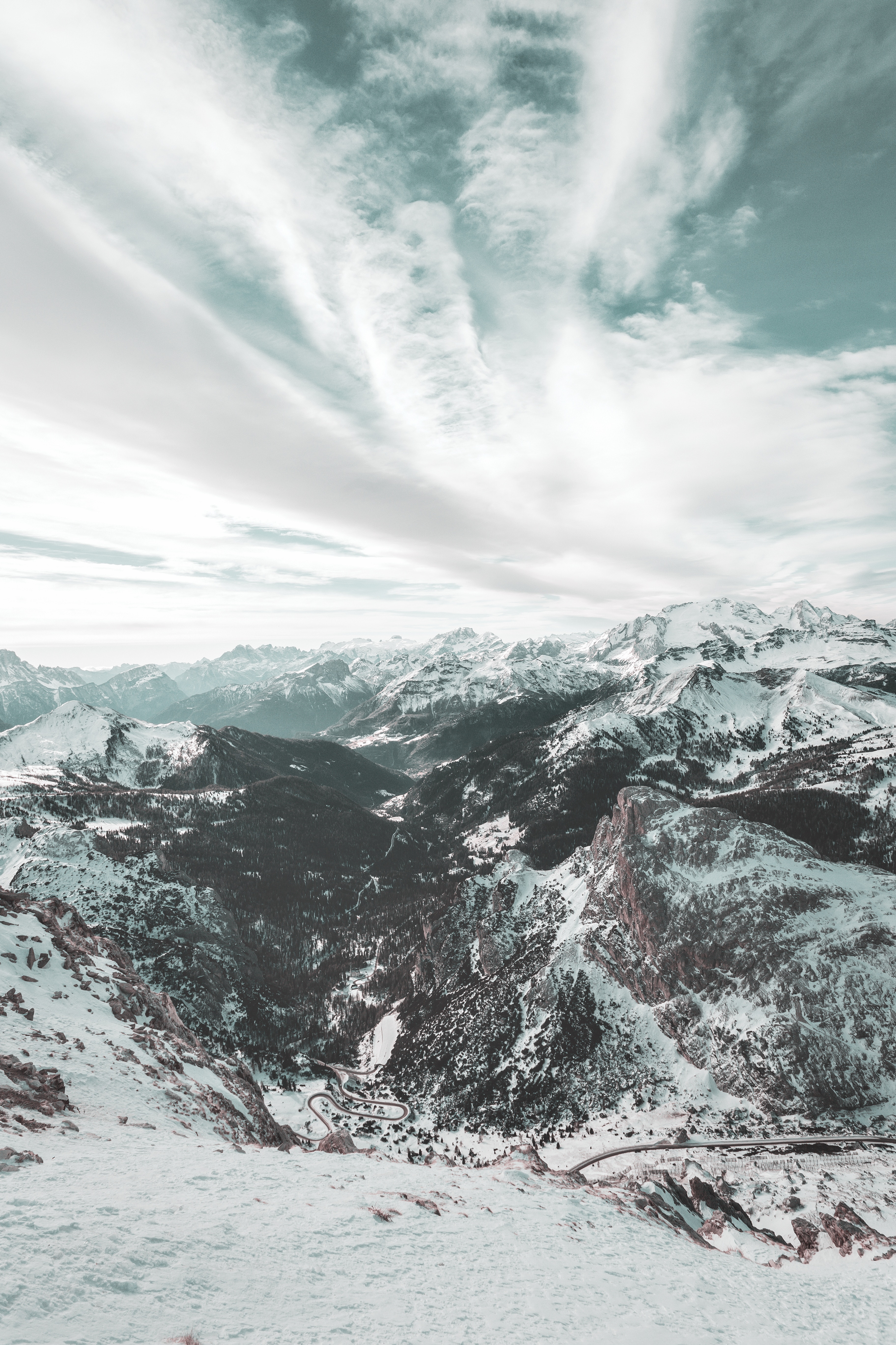 Download mobile wallpaper Clouds, Snow, Winter, Sky, View From Above, Nature, Mountains, Dolomites, Italy for free.