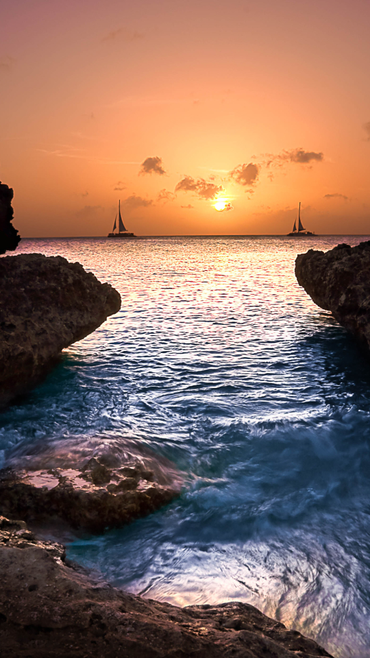 Download mobile wallpaper Sunset, Sea, Horizon, Coast, Ocean, Sailboat, Photography for free.