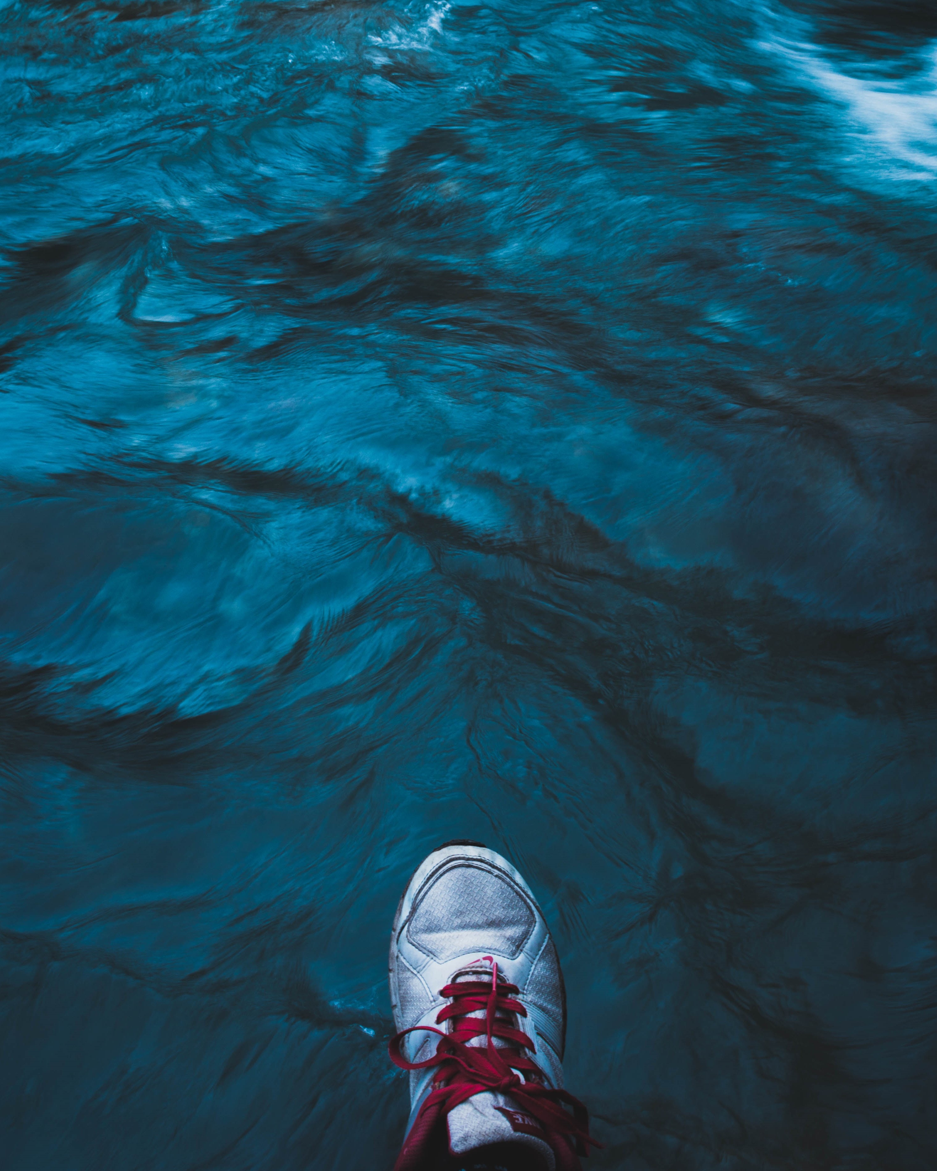 Download mobile wallpaper Miscellaneous, Miscellanea, Water, Legs, Flow, Sea, Sneakers, Shoes for free.