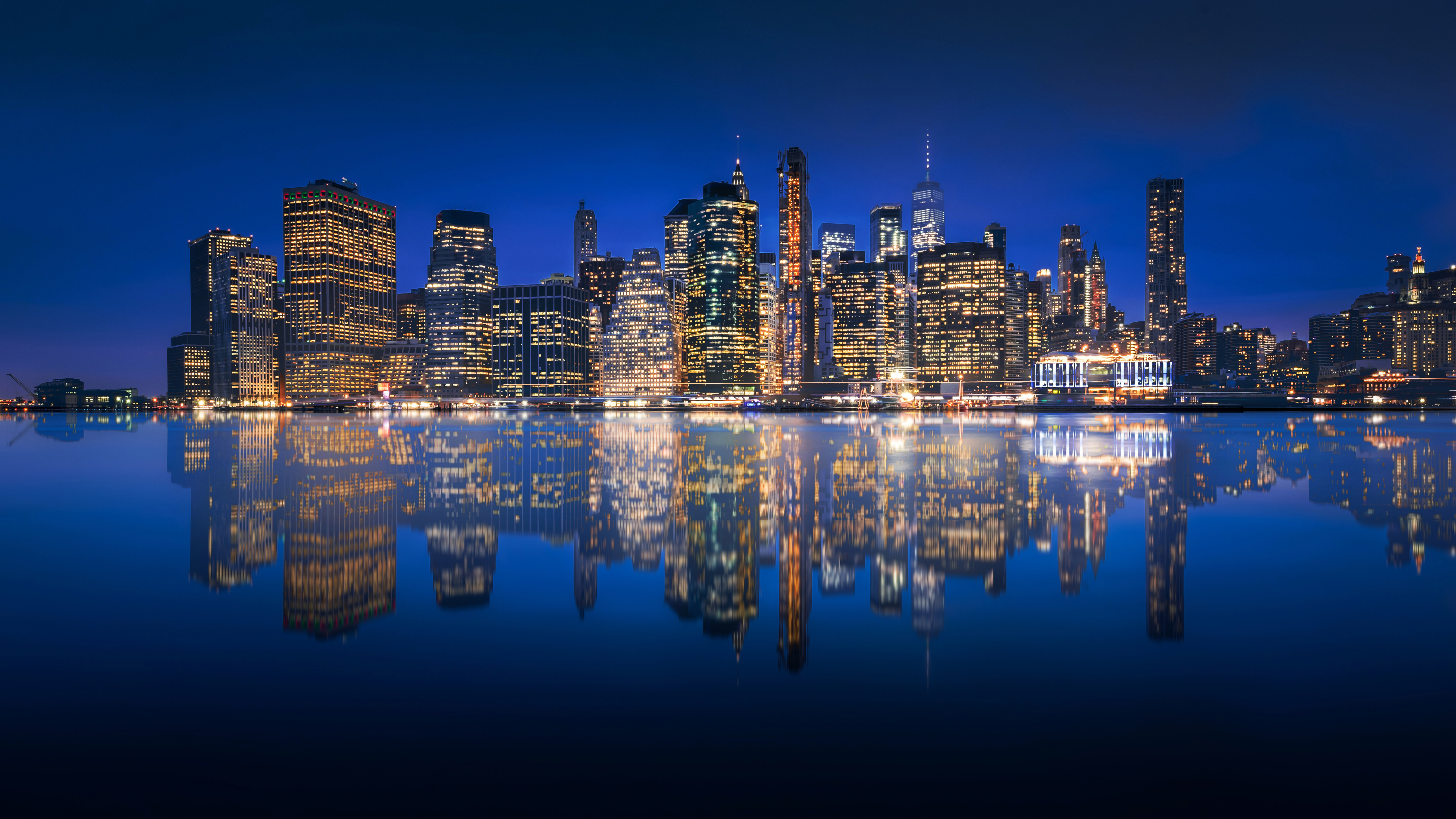Download mobile wallpaper Cities, Night, Usa, City, Skyscraper, Building, Reflection, New York, Manhattan, Man Made for free.