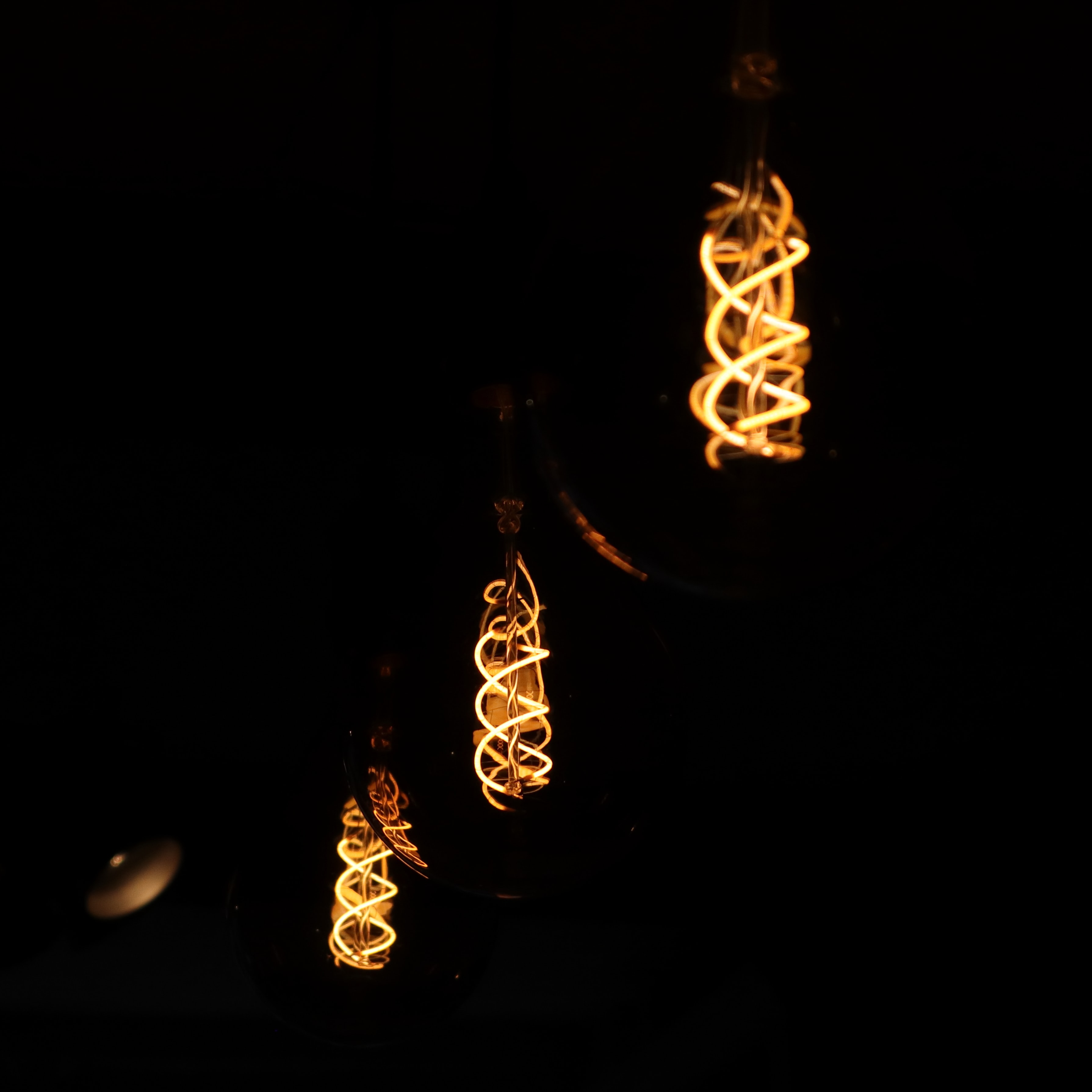 Download mobile wallpaper Lamps, Lamp, Glow, Spiral, Dark for free.