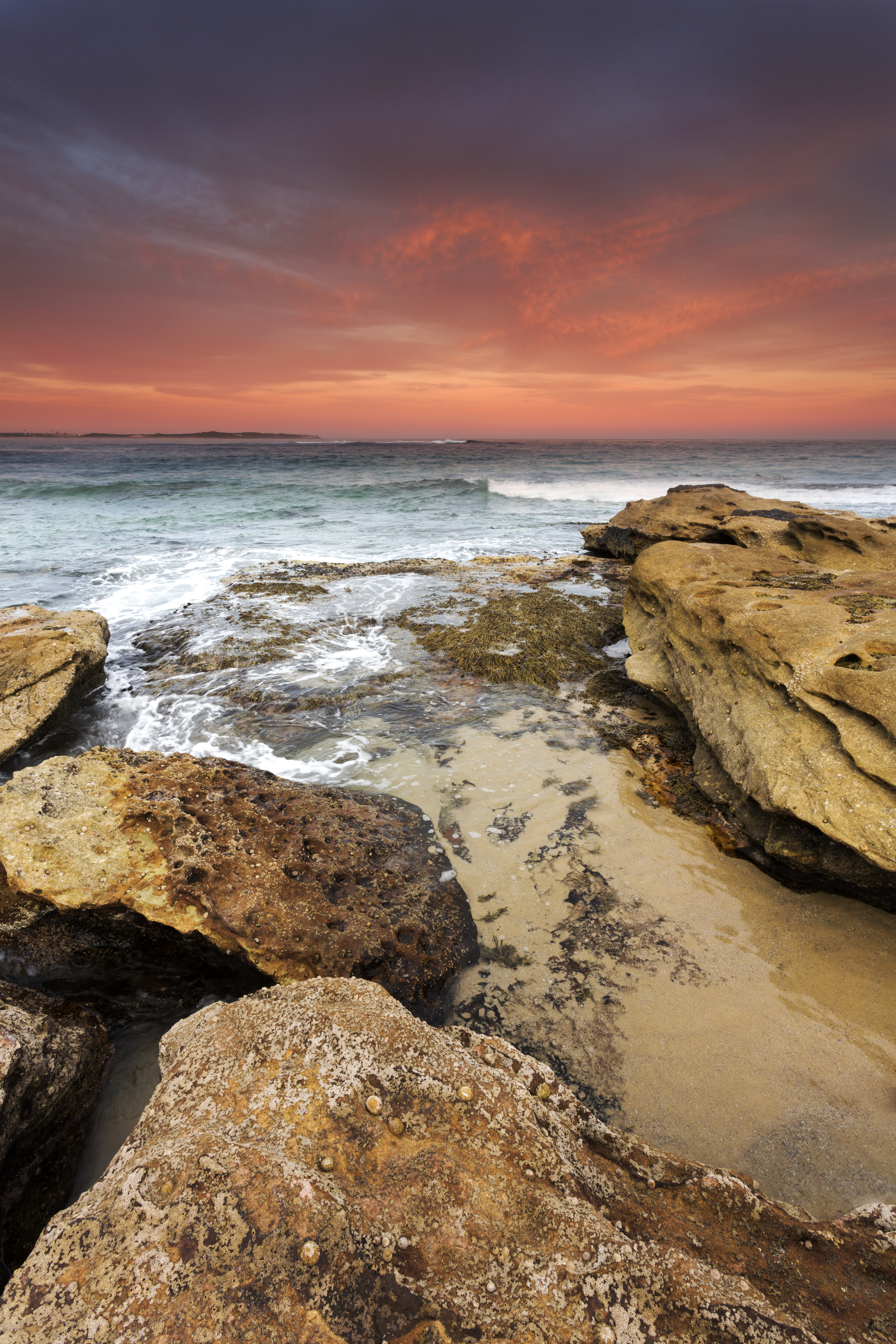 Download mobile wallpaper Rocks, Stones, Horizon, Sunset, Sea, Nature for free.