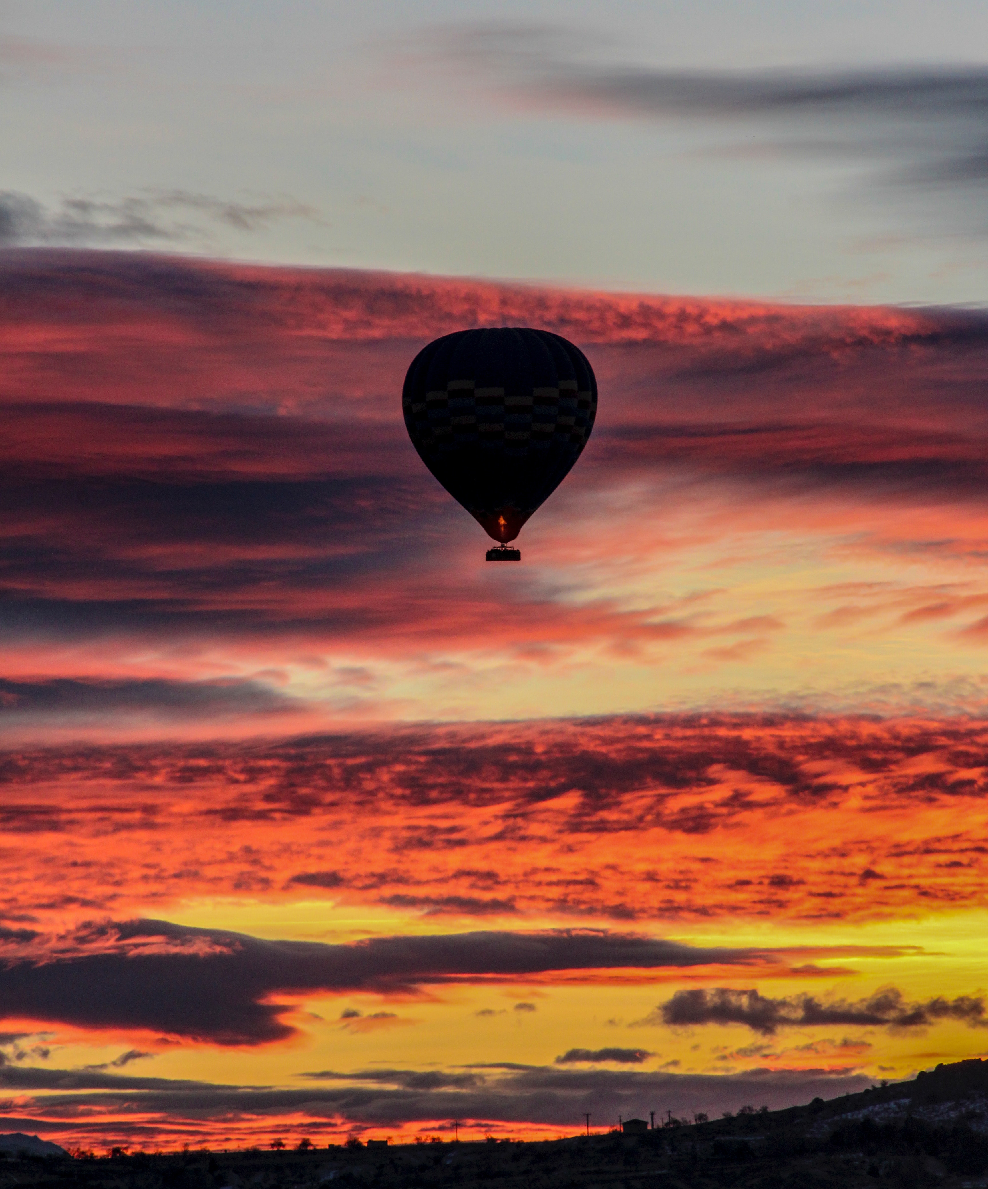 Download mobile wallpaper Sky, Clouds, Flight, Balloon, Sunset, Nature for free.