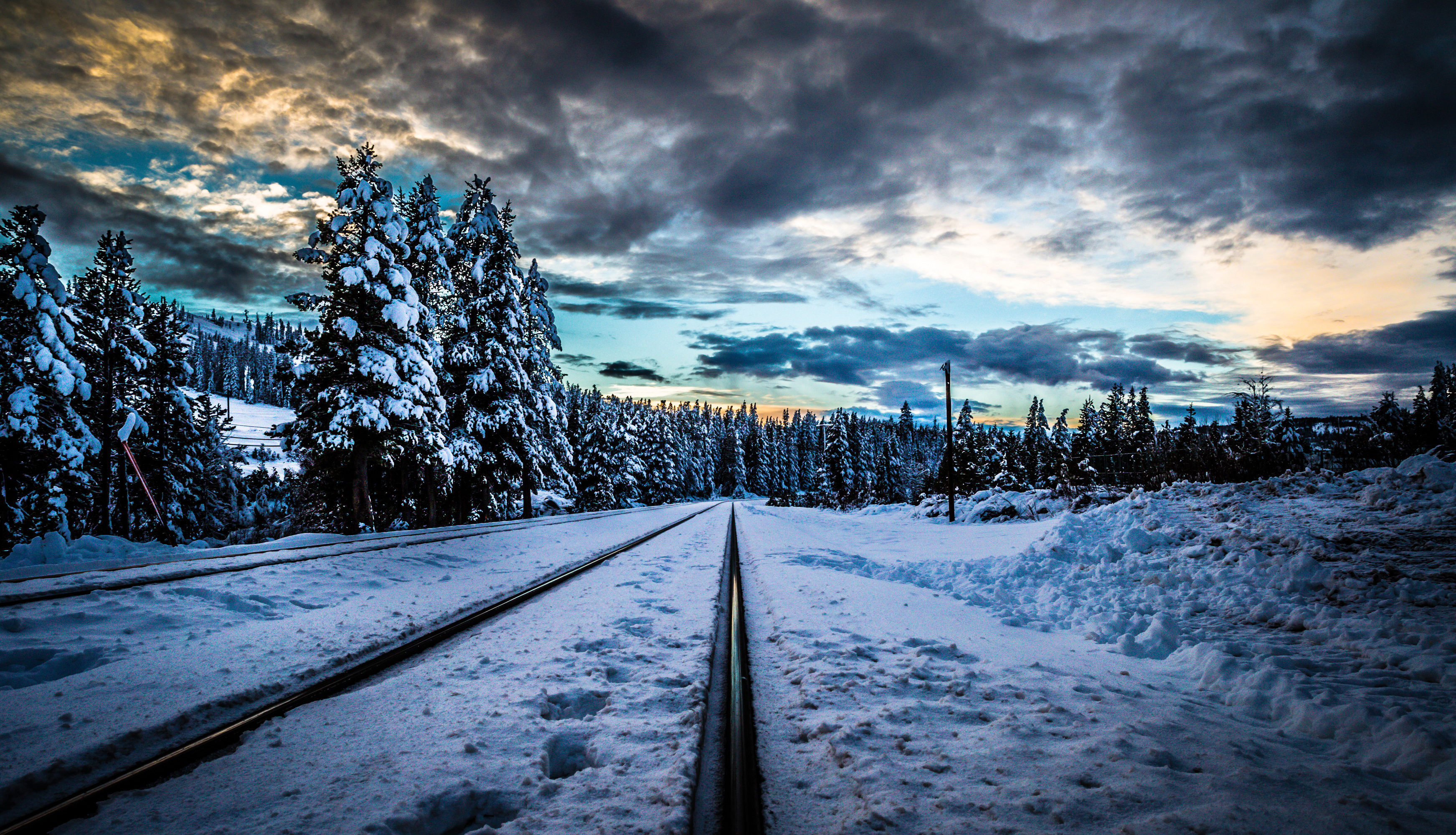 Download mobile wallpaper Winter, Snow, Tree, Earth, Cloud, Railroad, Man Made for free.